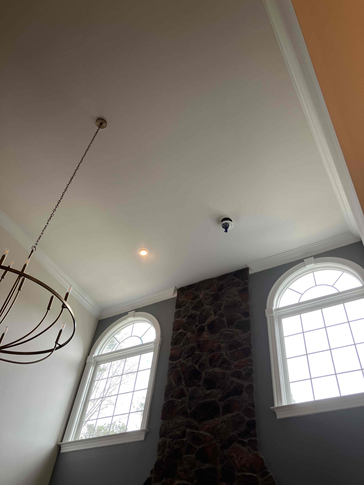 Showcasing craftsmanship and safety in a bright entry, Dawson's Electric & Air ensures polished lighting and reliable installations.