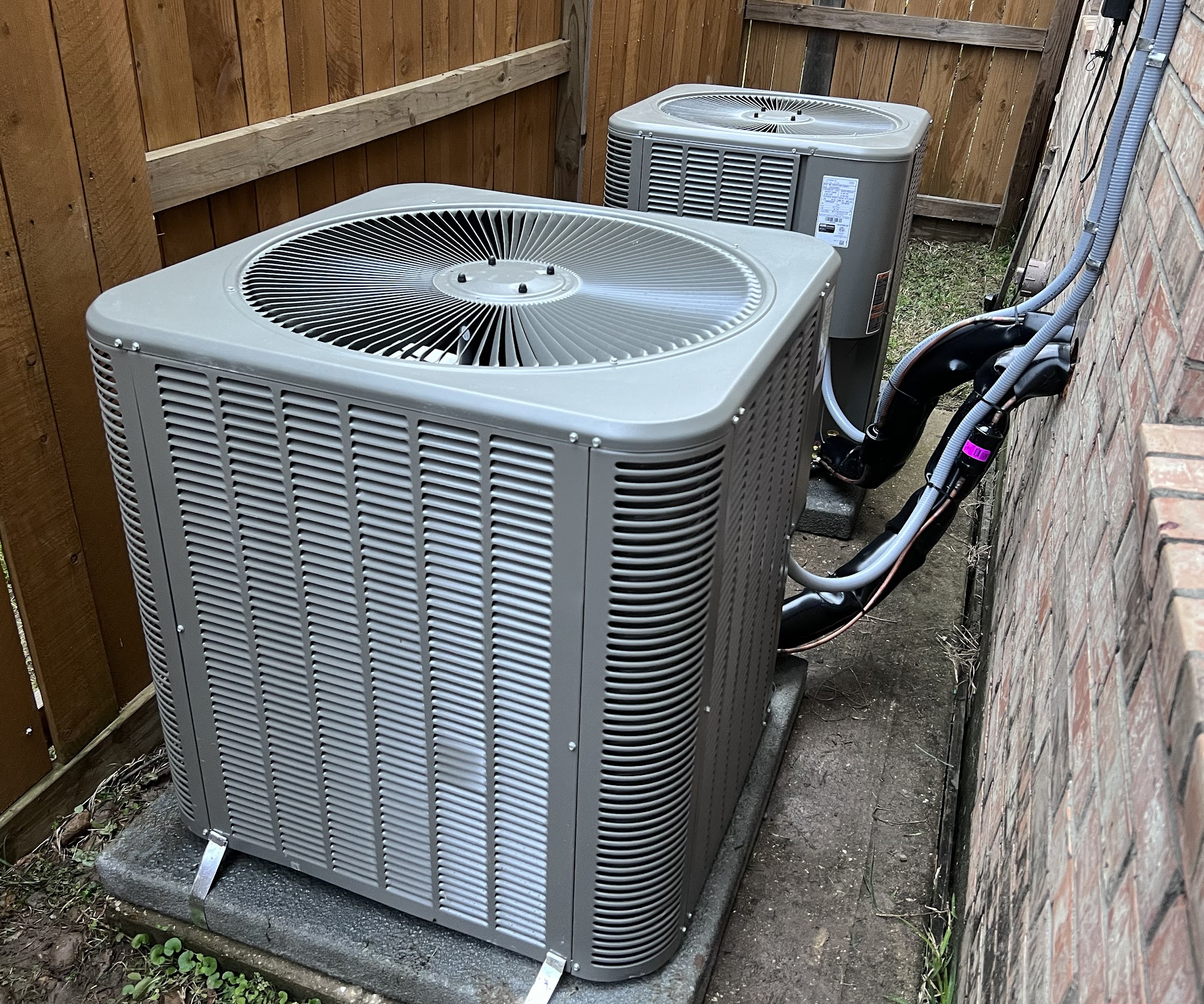 Reliable, neatly installed outdoor units show Abacus Plumbing, Air Conditioning & Electrical prioritizes professional workmanship and long-lasting performance.