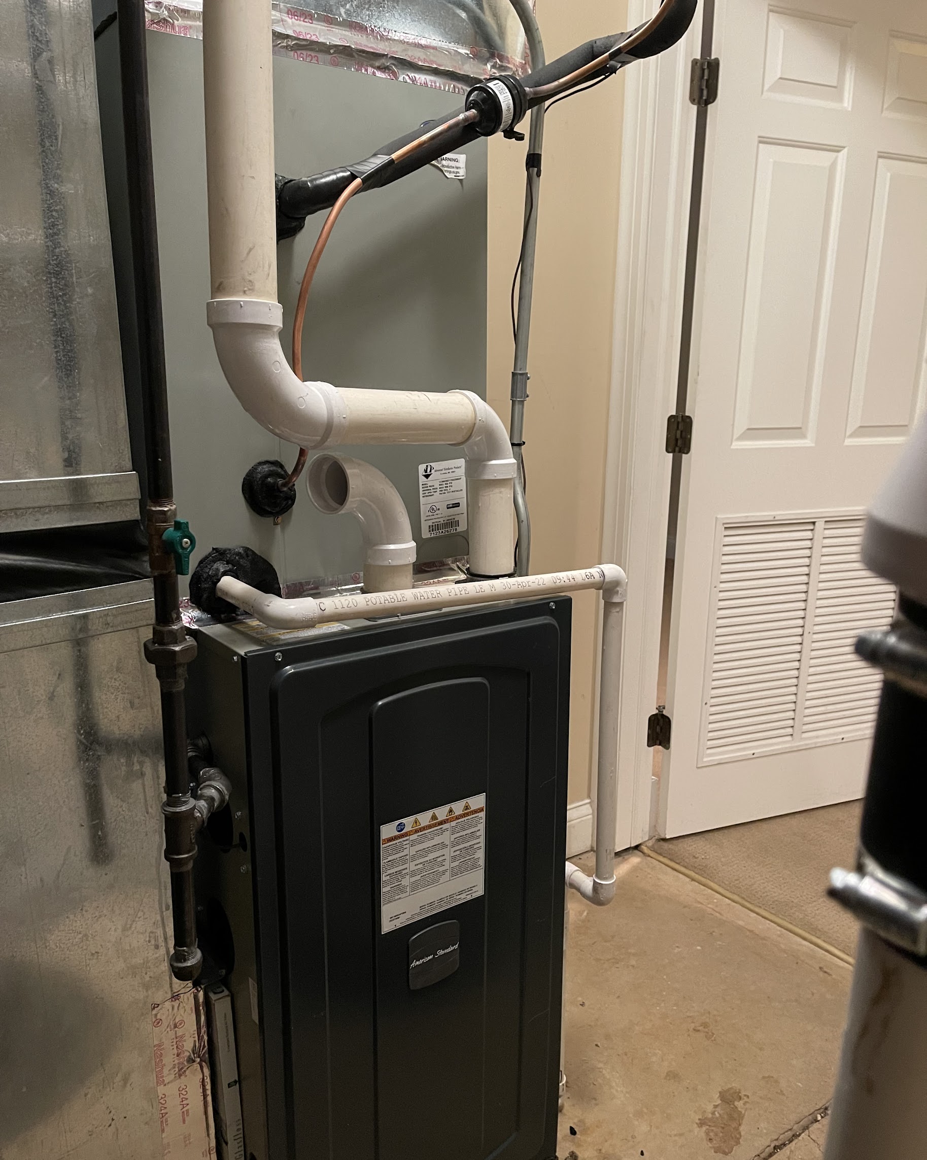A tidy, serviceable installation highlights Oasis Heating and Cooling's attention to clean, reliable HVAC workmanship for homeowners.