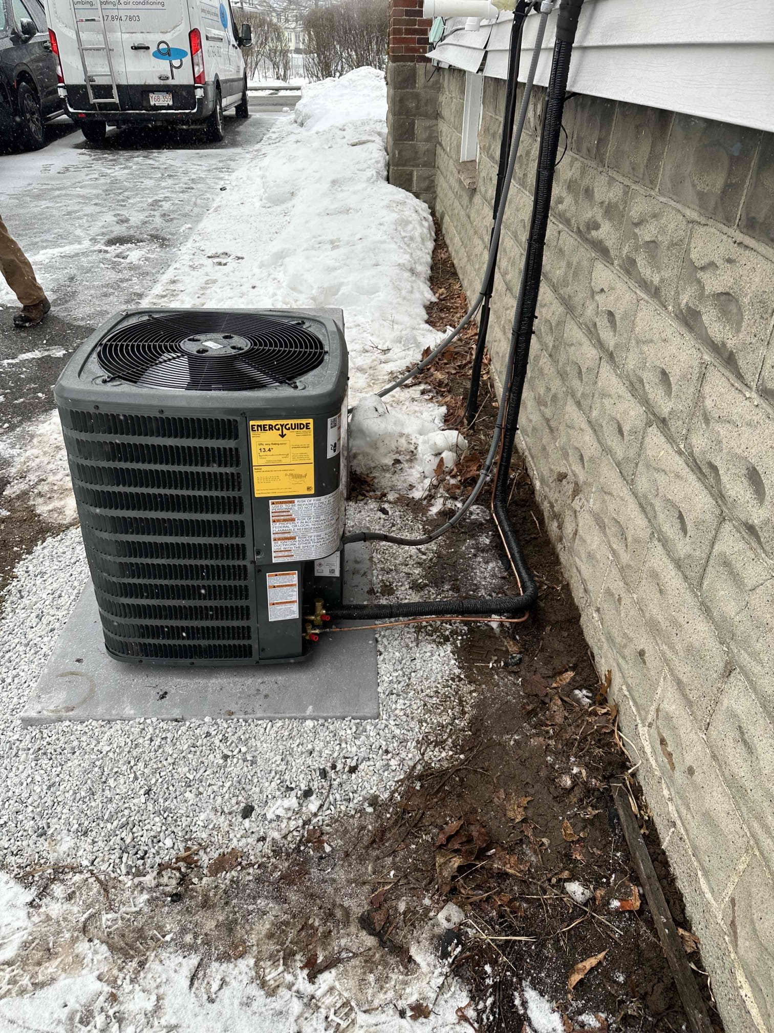 Trust Akian Plumbing, Heating, Cooling & Electric for your home's comfort solutions, no matter the season, as demonstrated by our expert installation of a new AC unit even amidst winter snowfall.