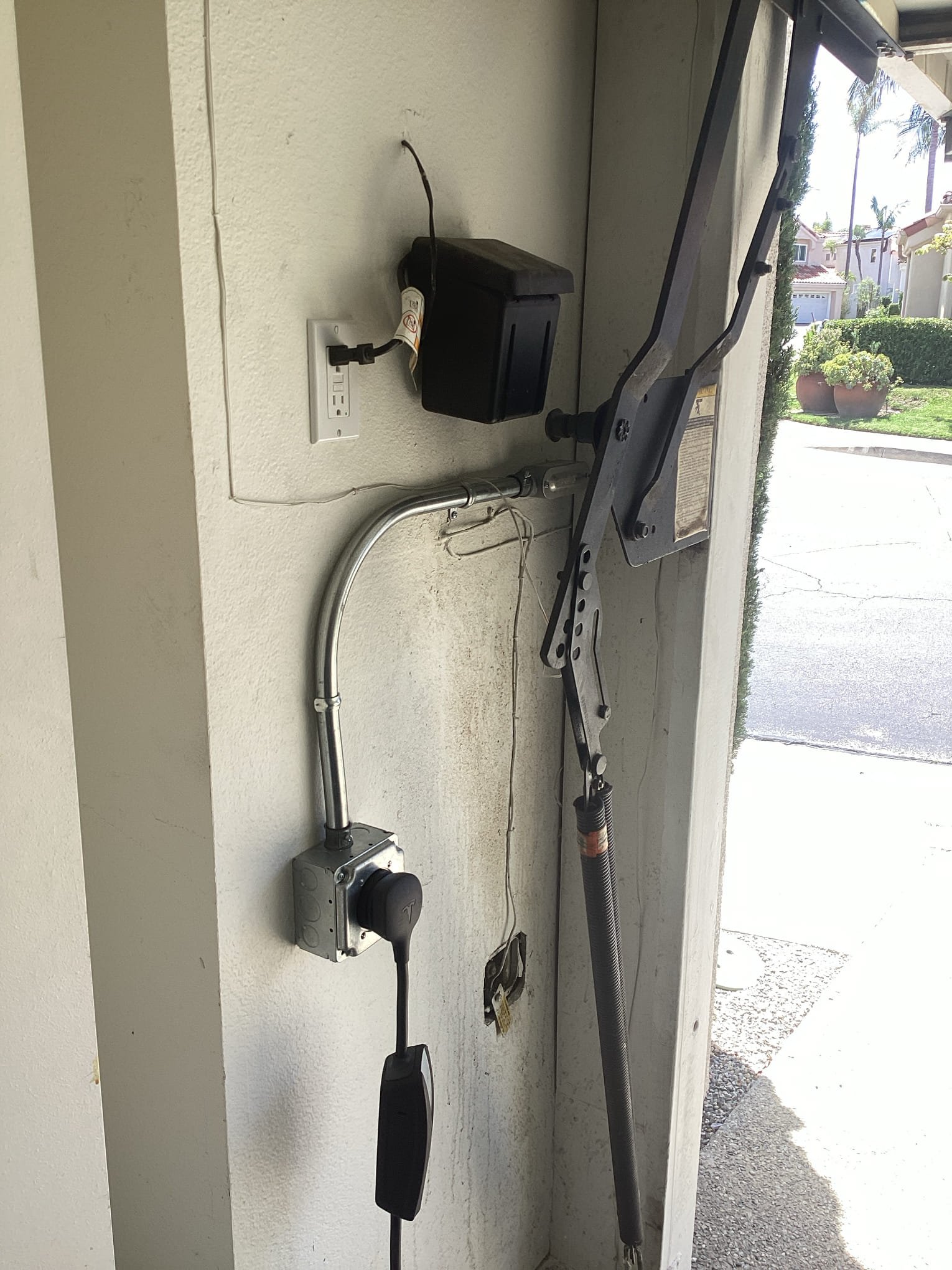 Powell Electric delivered tidy, code-minded garage wiring and a secure door operator installation that emphasizes safety and craftsmanship.