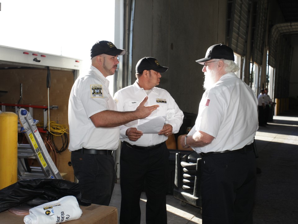 Abacus Plumbing, Air Conditioning & Electrical demonstrates reliable teamwork and professional service readiness as technicians review work details together.