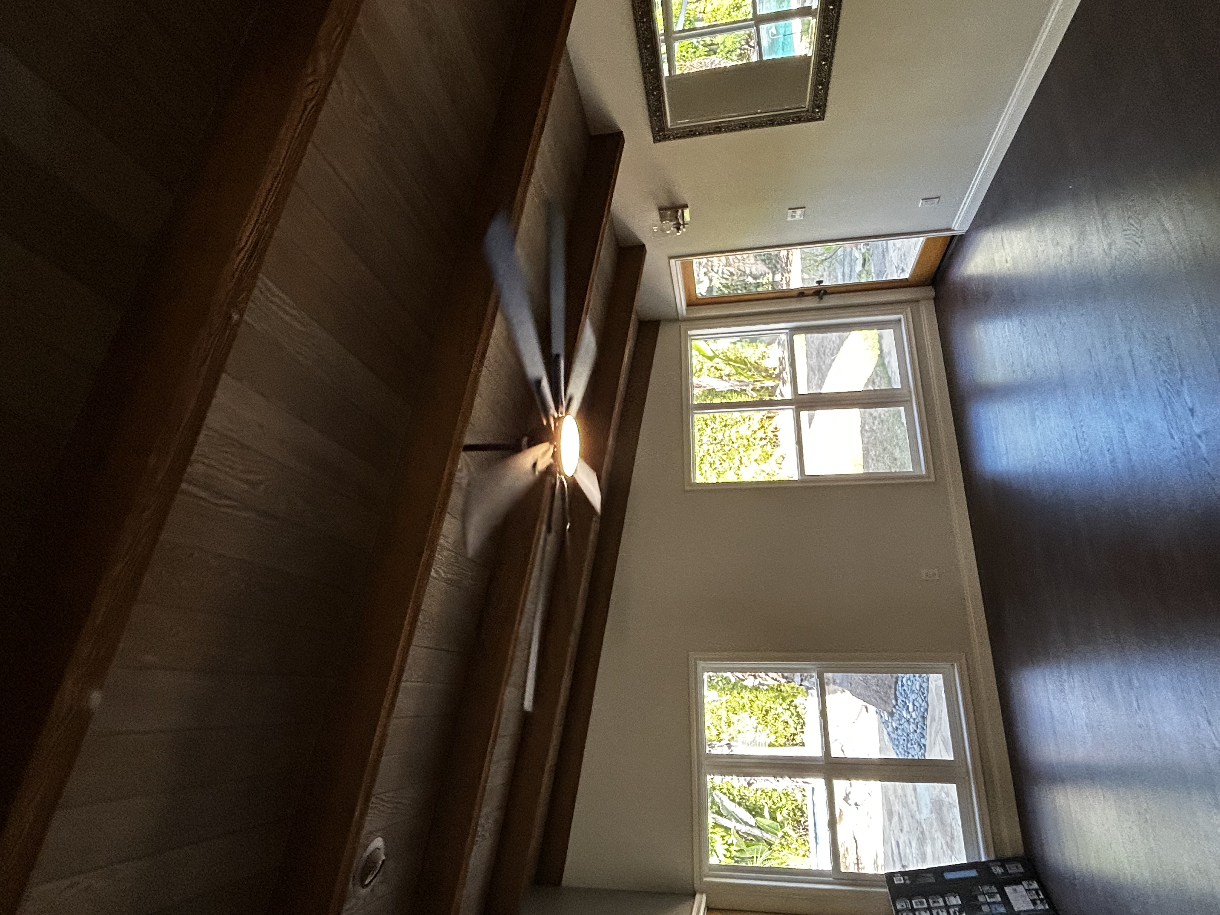 Powell Electric helped update this living room with a clean, well-installed ceiling fan and lighting that enhances the room's craftsmanship.