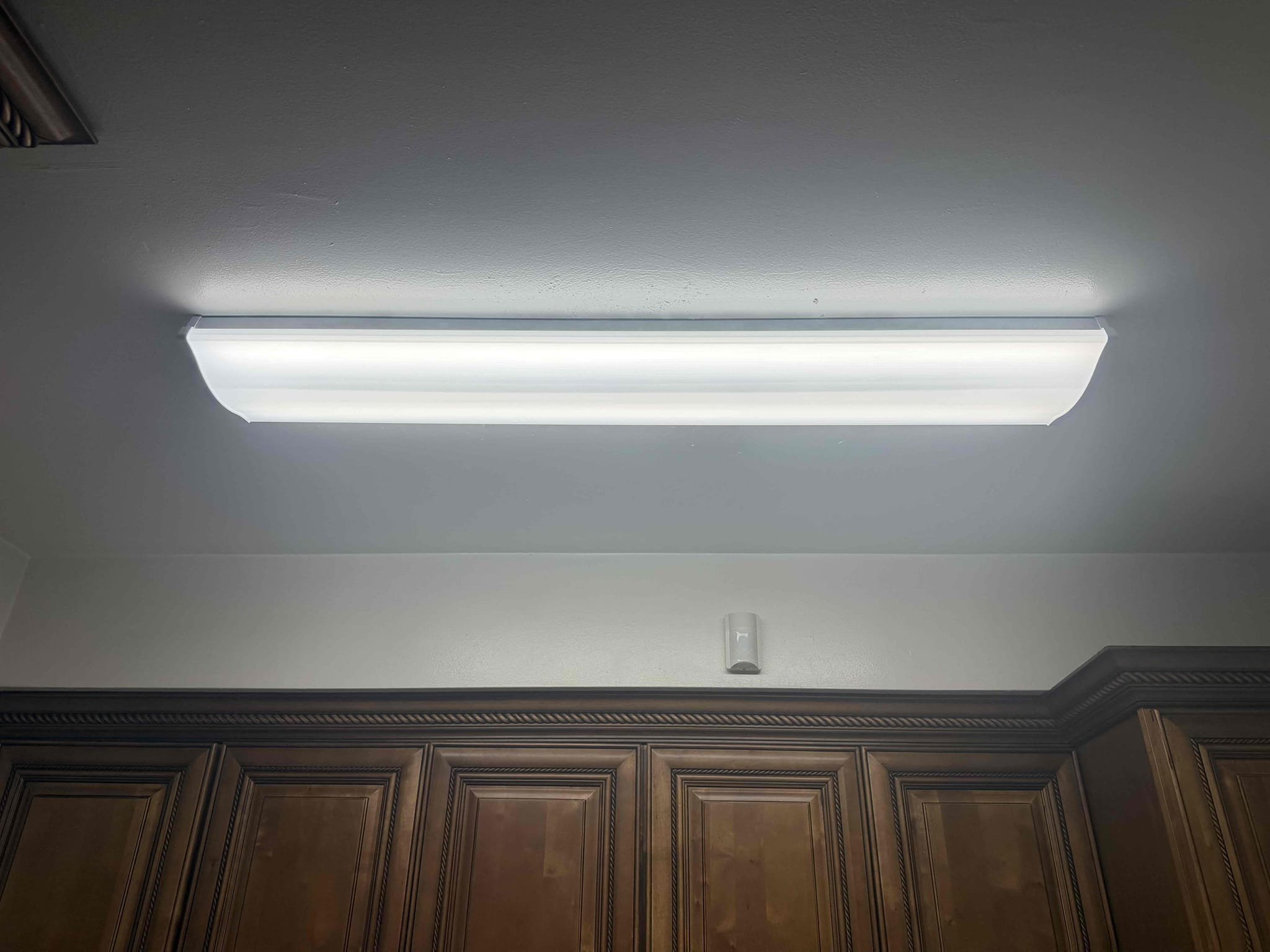 Bright, neatly installed overhead lighting shows Powell Electric's attention to clean, professional installations that improve safety and visibility.