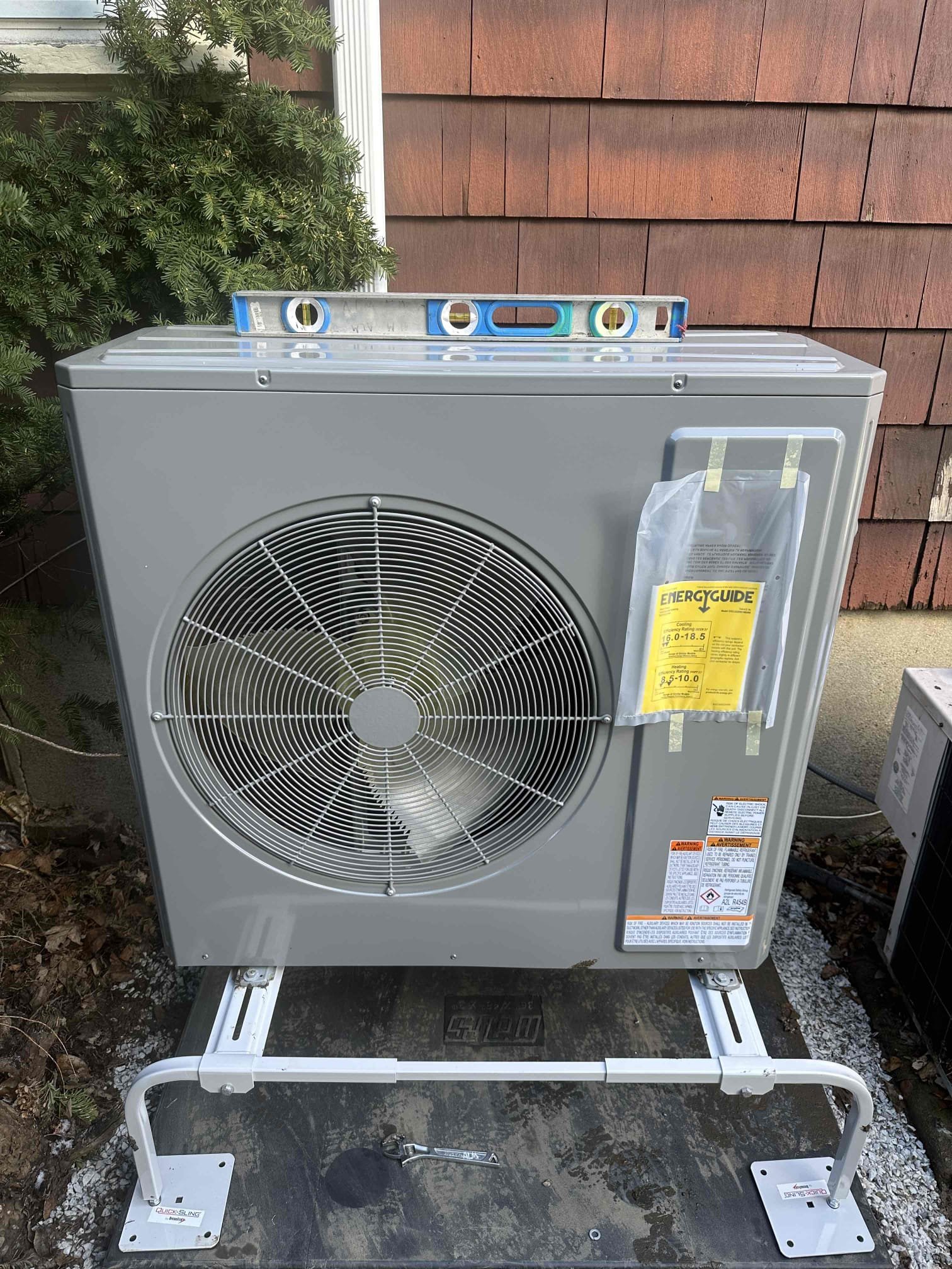 Akian Plumbing, Heating, Cooling & Electric shows precise, professional HVAC installation with visible leveling and clean mounting for long lasting performance.