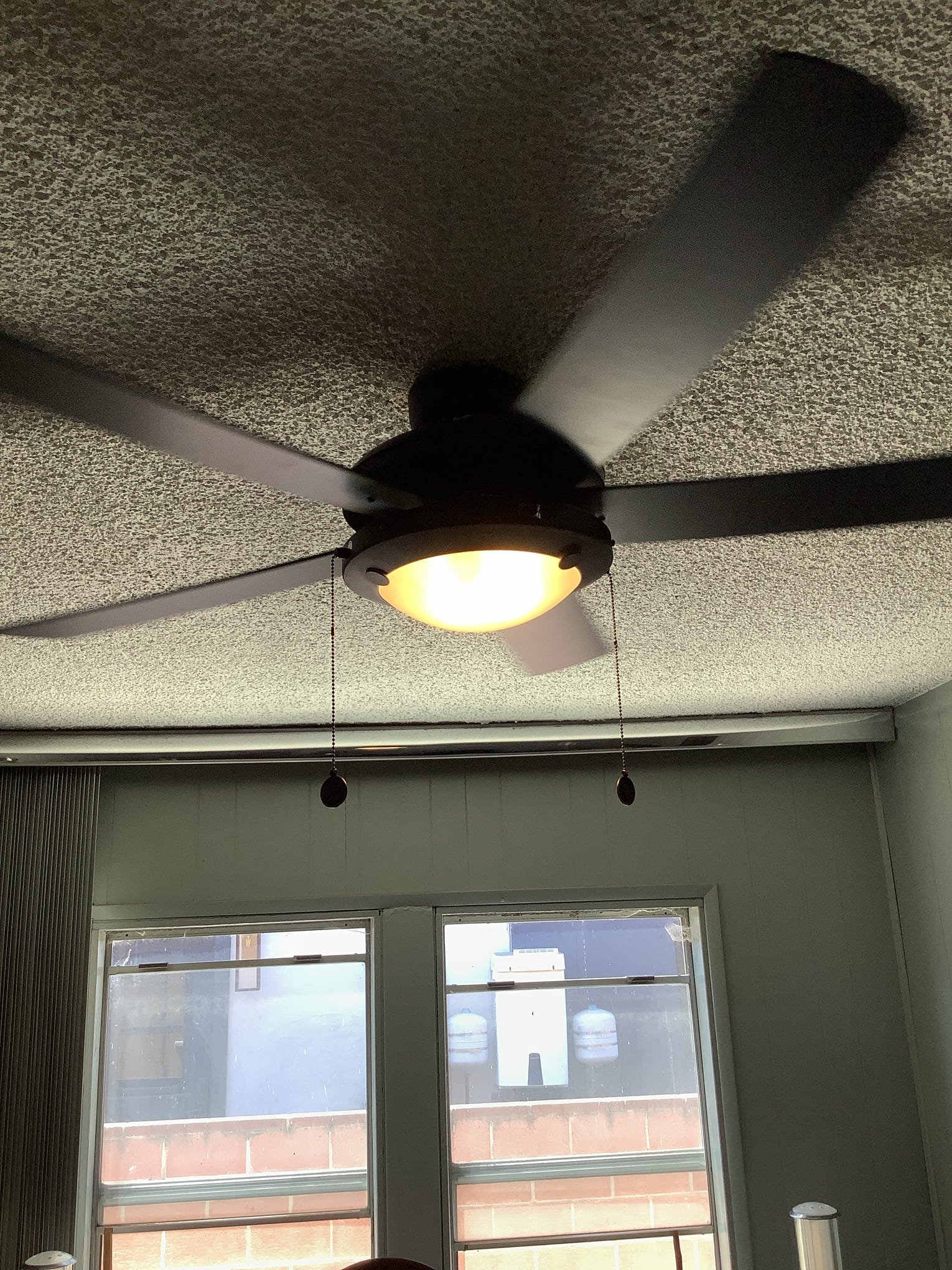 Powell Electric installed this sleek ceiling fan and illuminated fixture to bring reliable comfort and polished style to a living space.