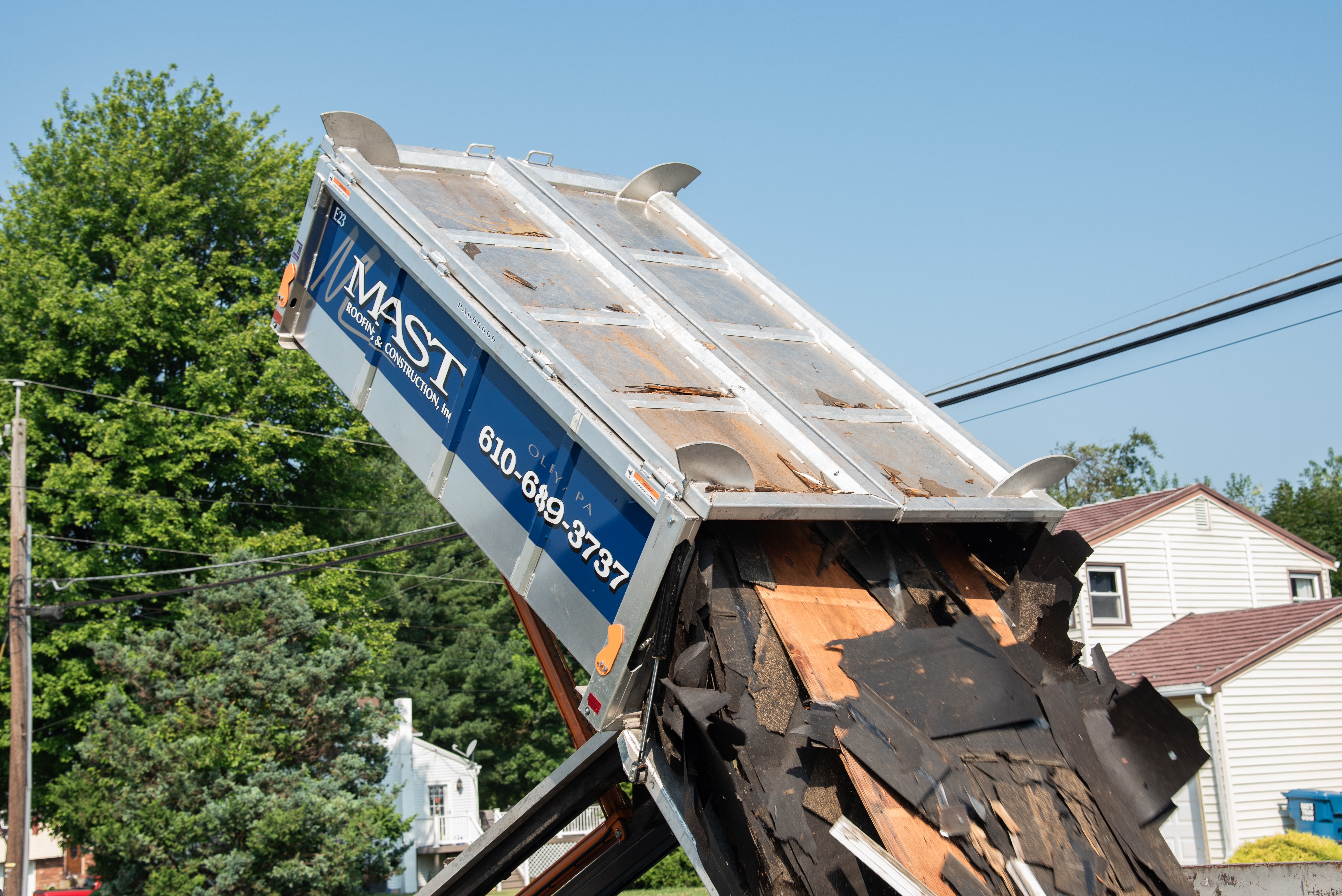 Mast Roofing & Construction ensures efficient and thorough project management, one load at a time.