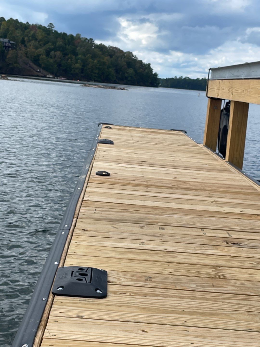 Solid craftsmanship shows in the sturdy lakeside dock built for lasting use, trust C&T Electric LLC for reliable waterfront installations.