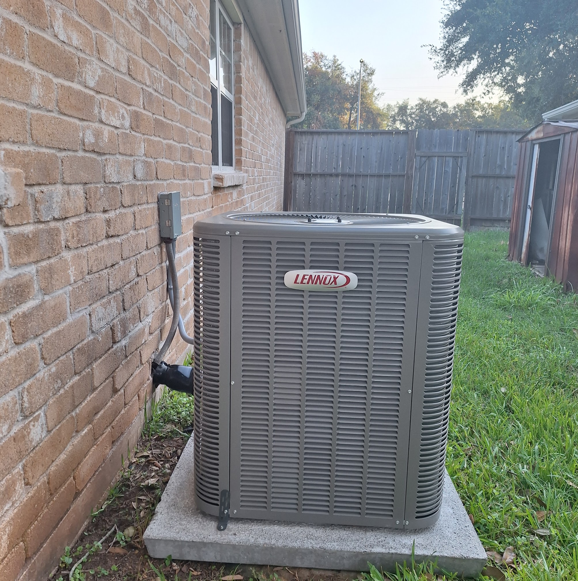 Clean, reliable installation displayed in a residential yard shows Abacus Plumbing, Air Conditioning & Electrical delivering professional HVAC service customers can trust.