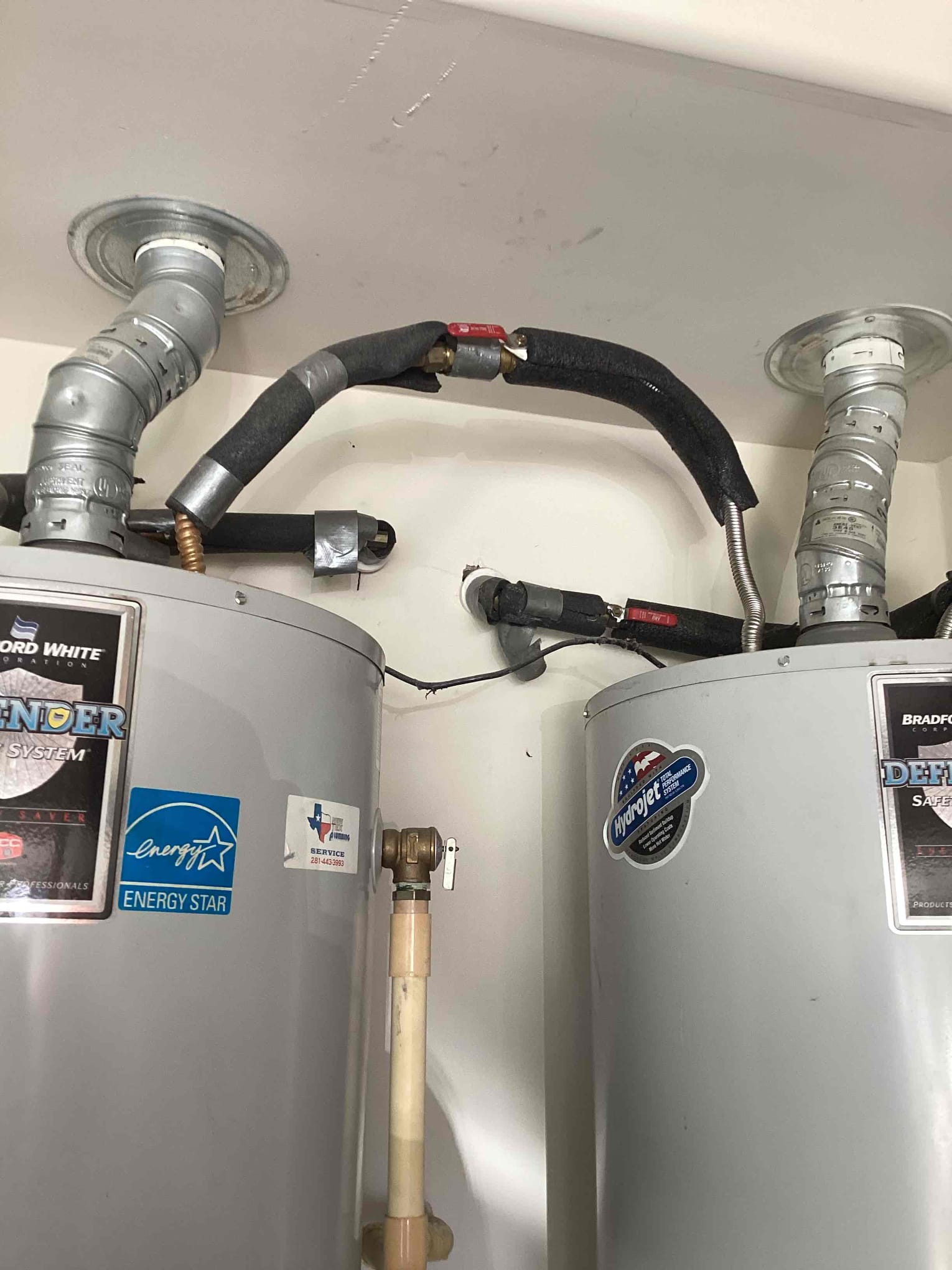 Trusted installation and attention to efficiency are clear in this dual water heater setup by Abacus Plumbing, Air Conditioning & Electrical.
