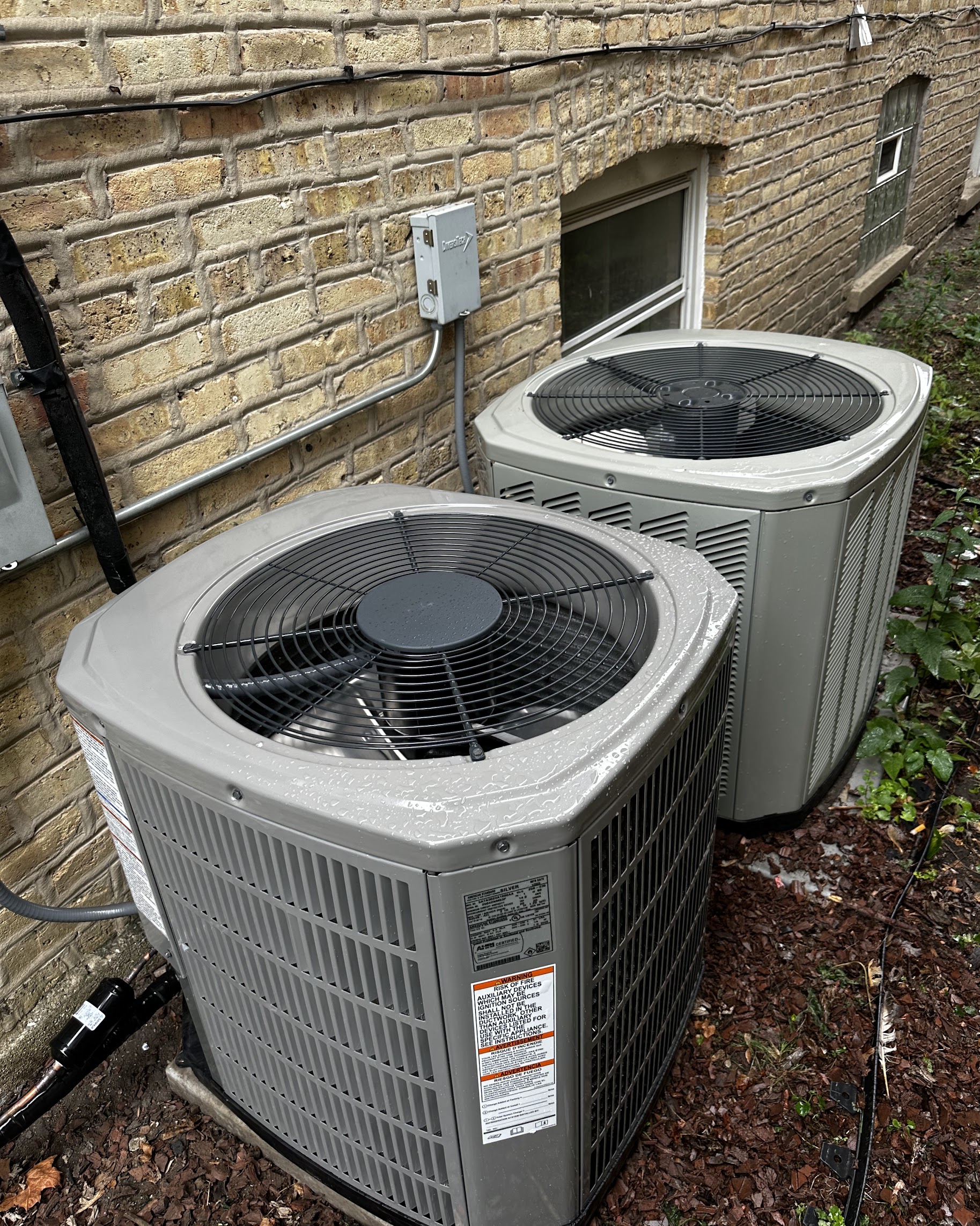 Clean, well-maintained outdoor condensers show the dependable craftsmanship customers expect from Oasis Heating and Cooling in every installation.