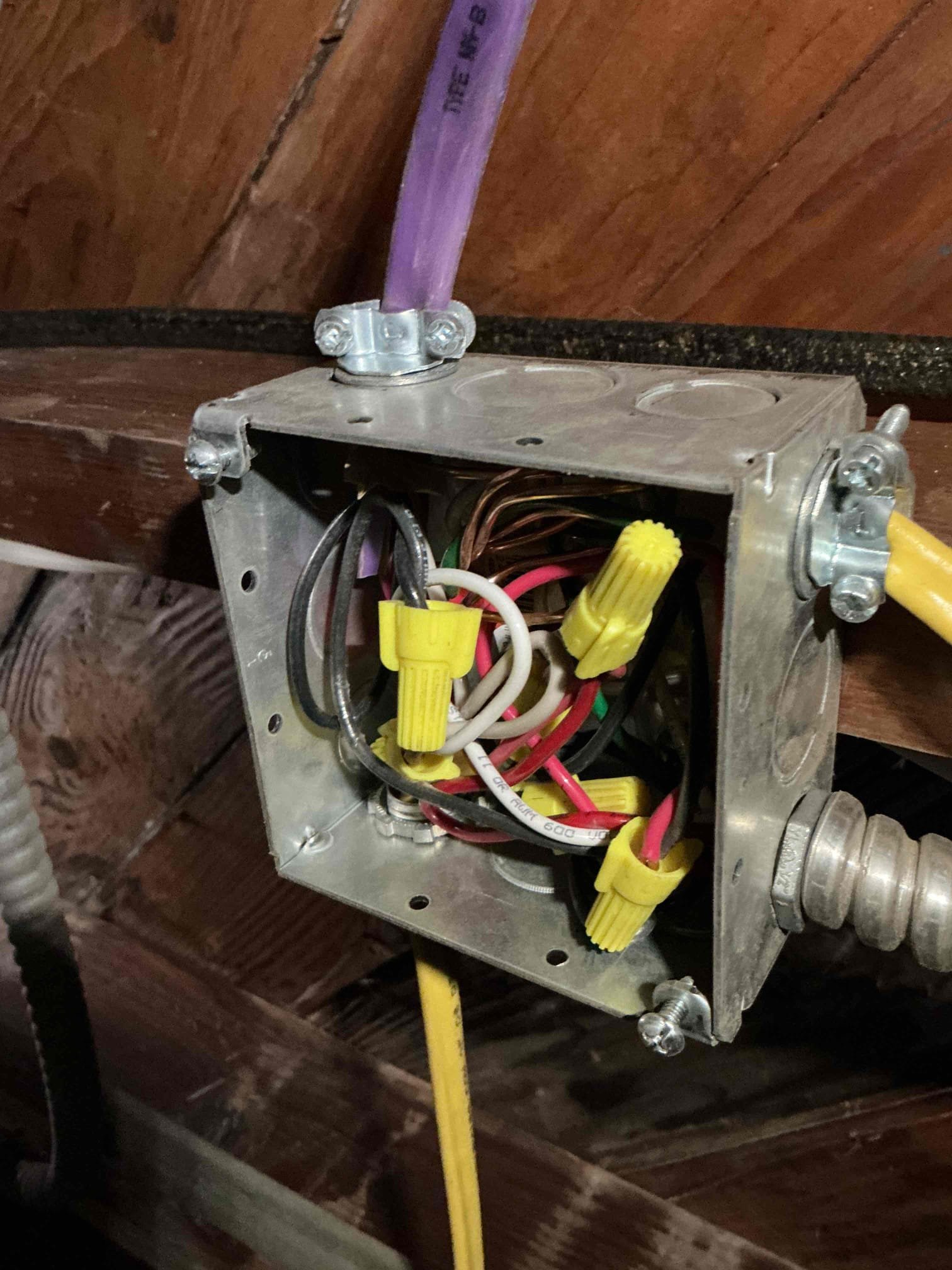 Powell Electric demonstrates tidy, code-conscious wiring in this attic junction box to give homeowners confidence in safety and durability.