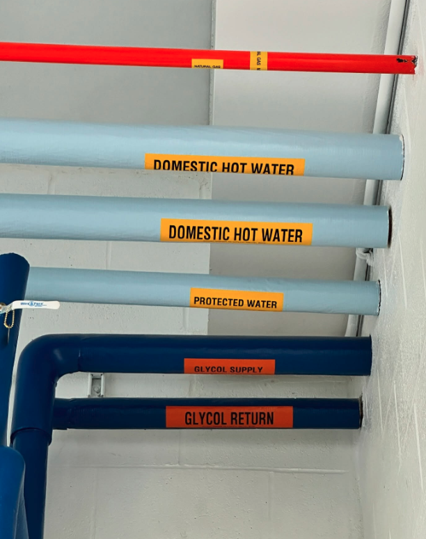 Hope Plumbing showcases clean, clearly labeled piping that reflects professional installation and durable protection for your hot water systems.