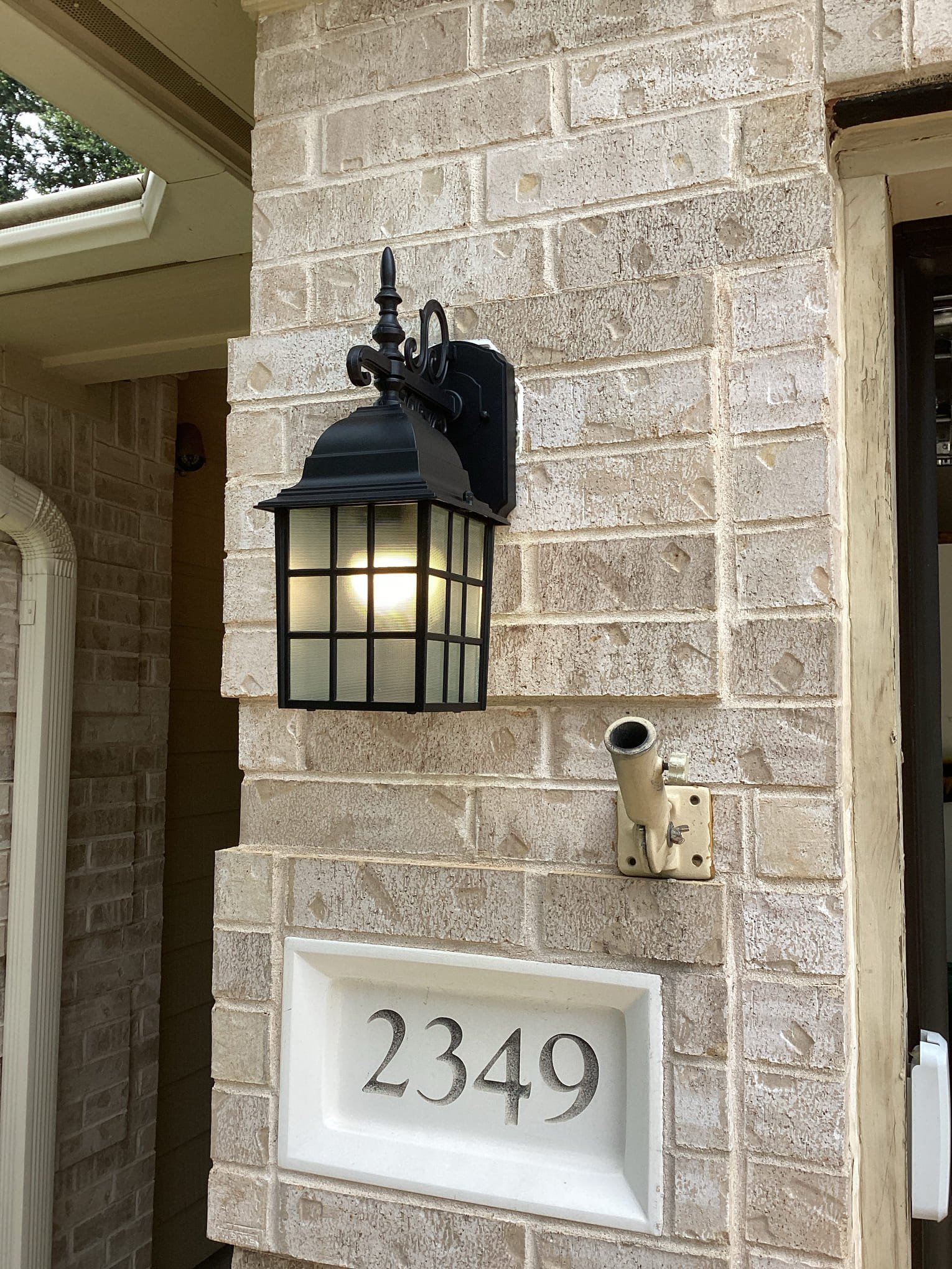 Illuminate your home's exterior with quality lighting solutions from A Team Home Services, ensuring your entryway is both stylish and safe.