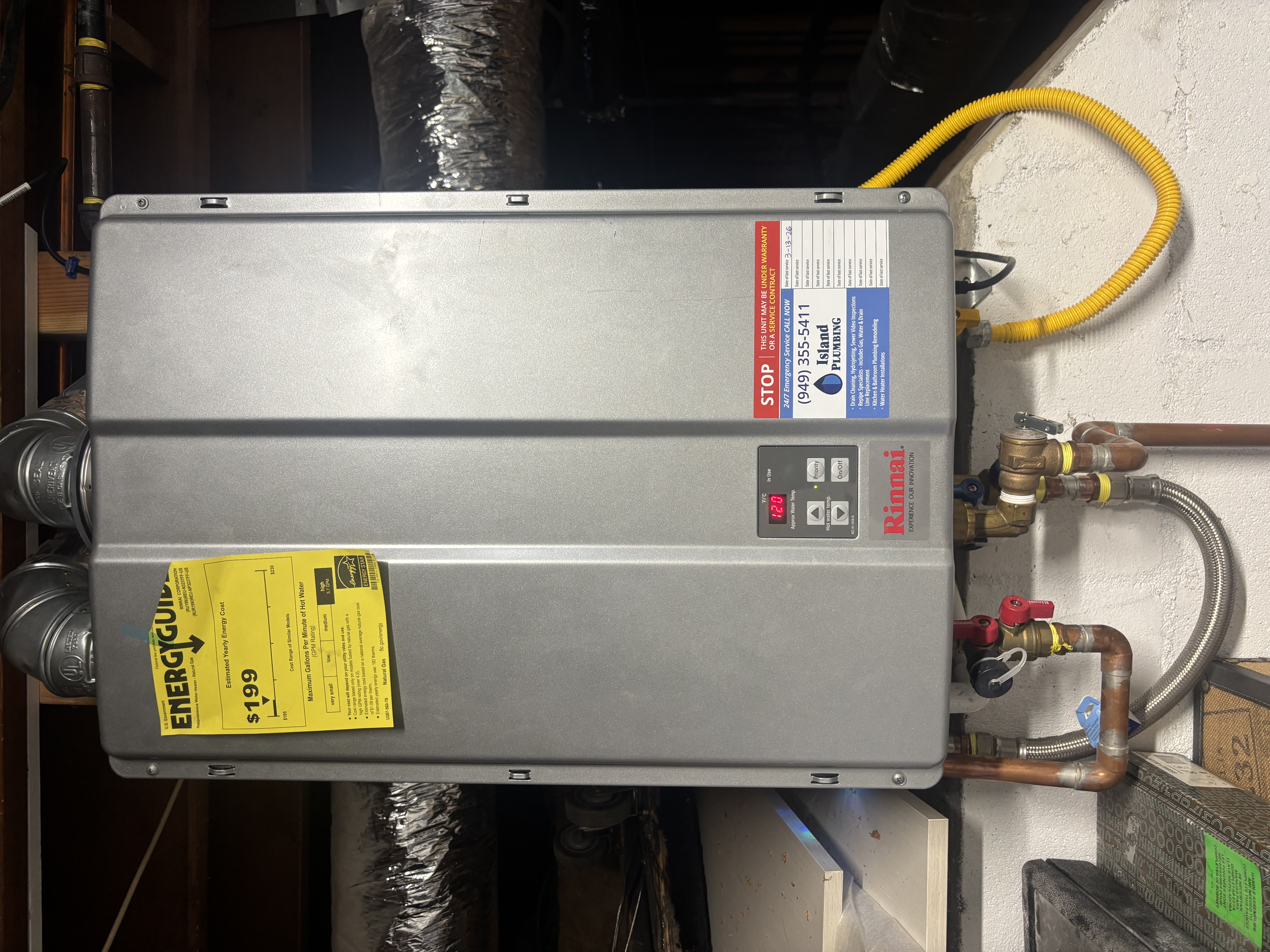A precise, efficient tankless water heater installation by Island Plumbing highlights dependable performance and clear service access for homeowners.
