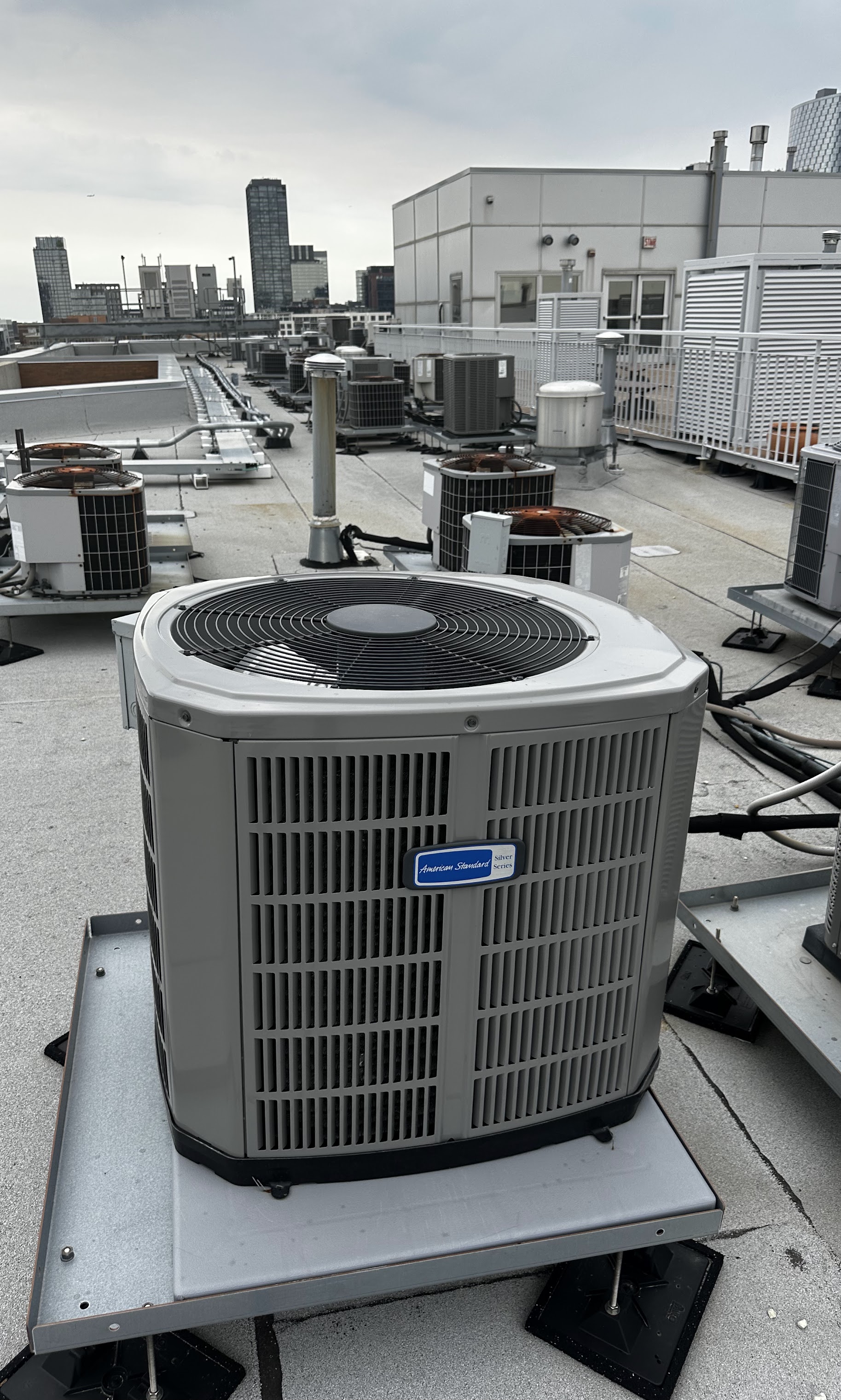 Clean, professionally installed rooftop HVAC units showcase the reliable workmanship customers trust from Oasis Heating and Cooling.