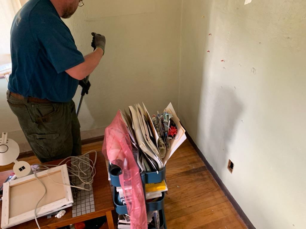 A skilled technician tidies and repairs an exposed outlet with care and safety in mind, giving customers confidence in Shocking Difference LLC.