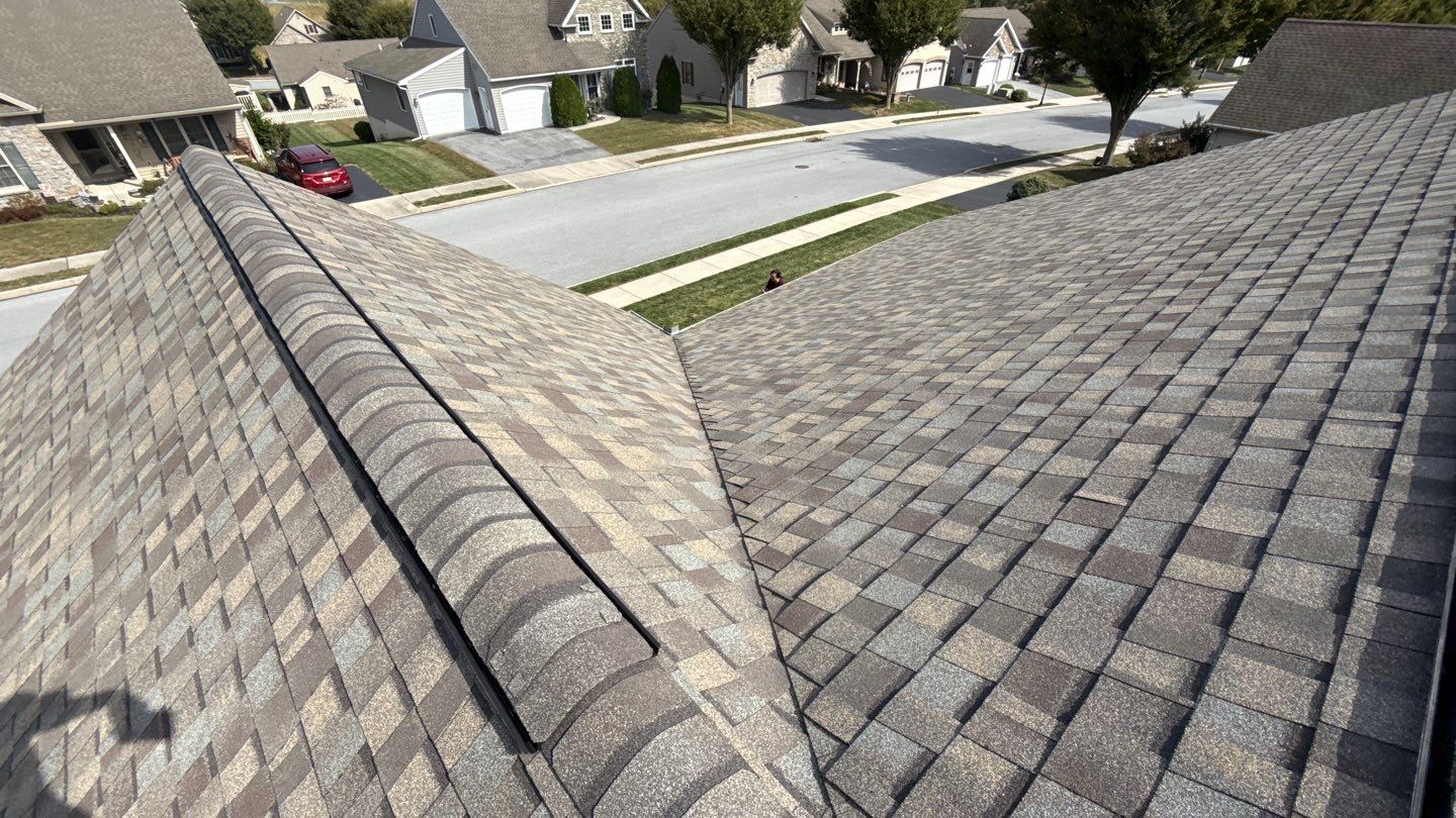Showcasing durable craftsmanship and clean ridge work, Mosaic Roofing & Exteriors protects your home with proven asphalt shingle reliability.