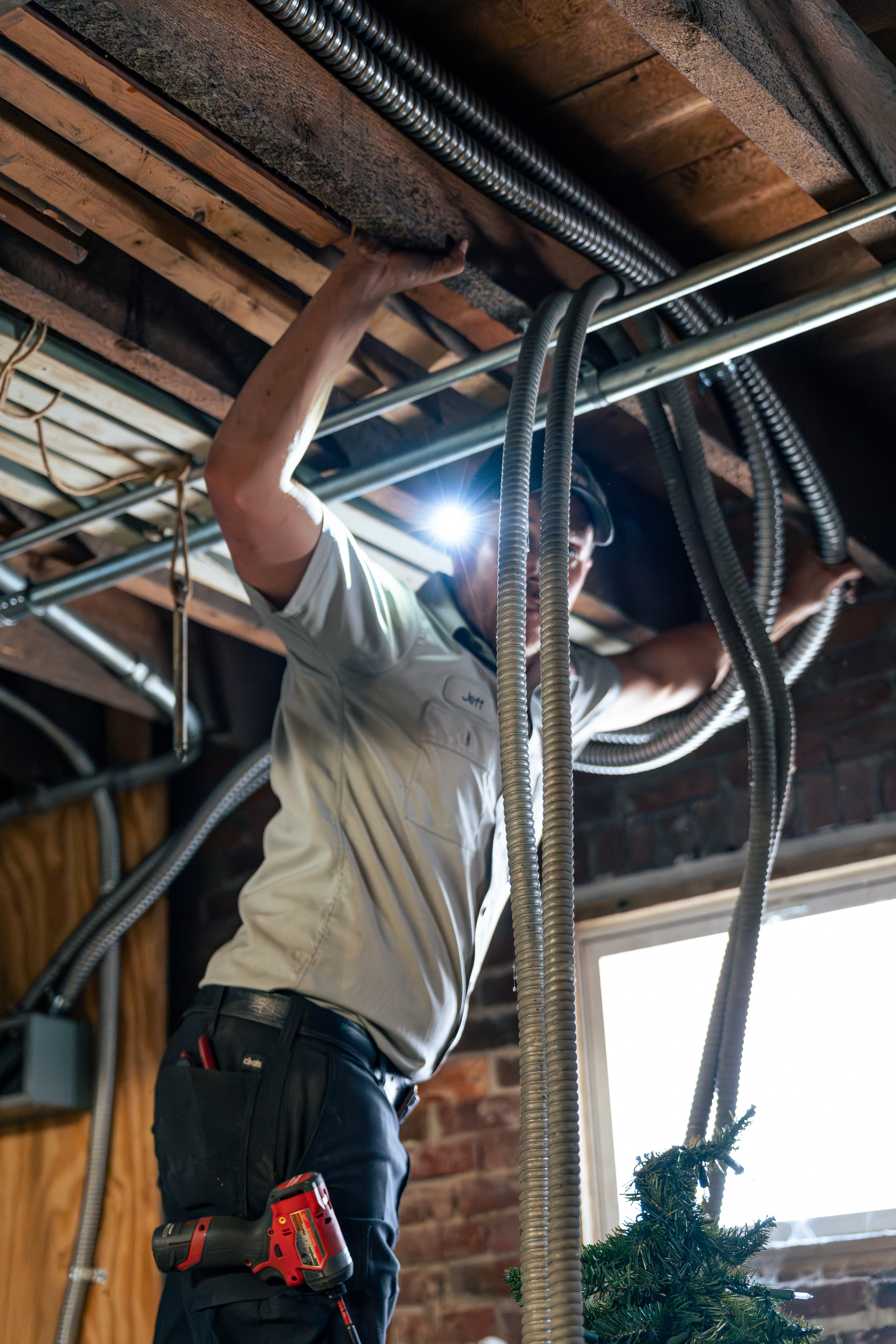 Trust Lloyd Plumbing, Heating, Air, Electrical for experienced technicians who safely handle electrical and conduit work in tight basement spaces.