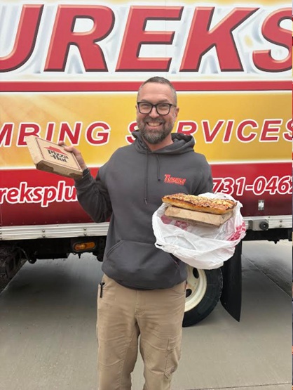 Friendly technicians and clear vehicle branding show Tureks Plumbing Services delivering reliable, professional service with a personal touch.