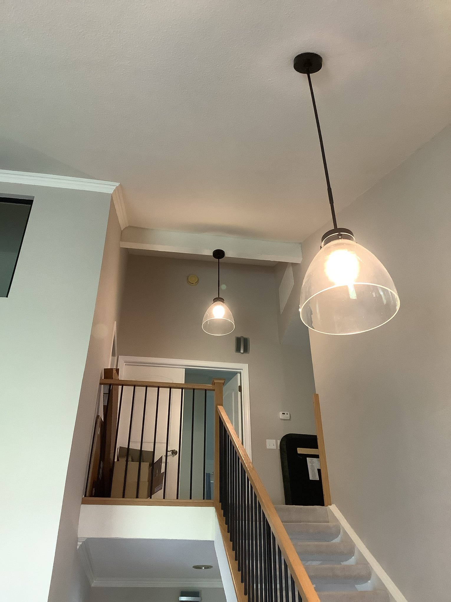 Bright, professionally installed pendant lighting enhances this entryway, showcasing Powell Electric's attention to neat, reliable workmanship.