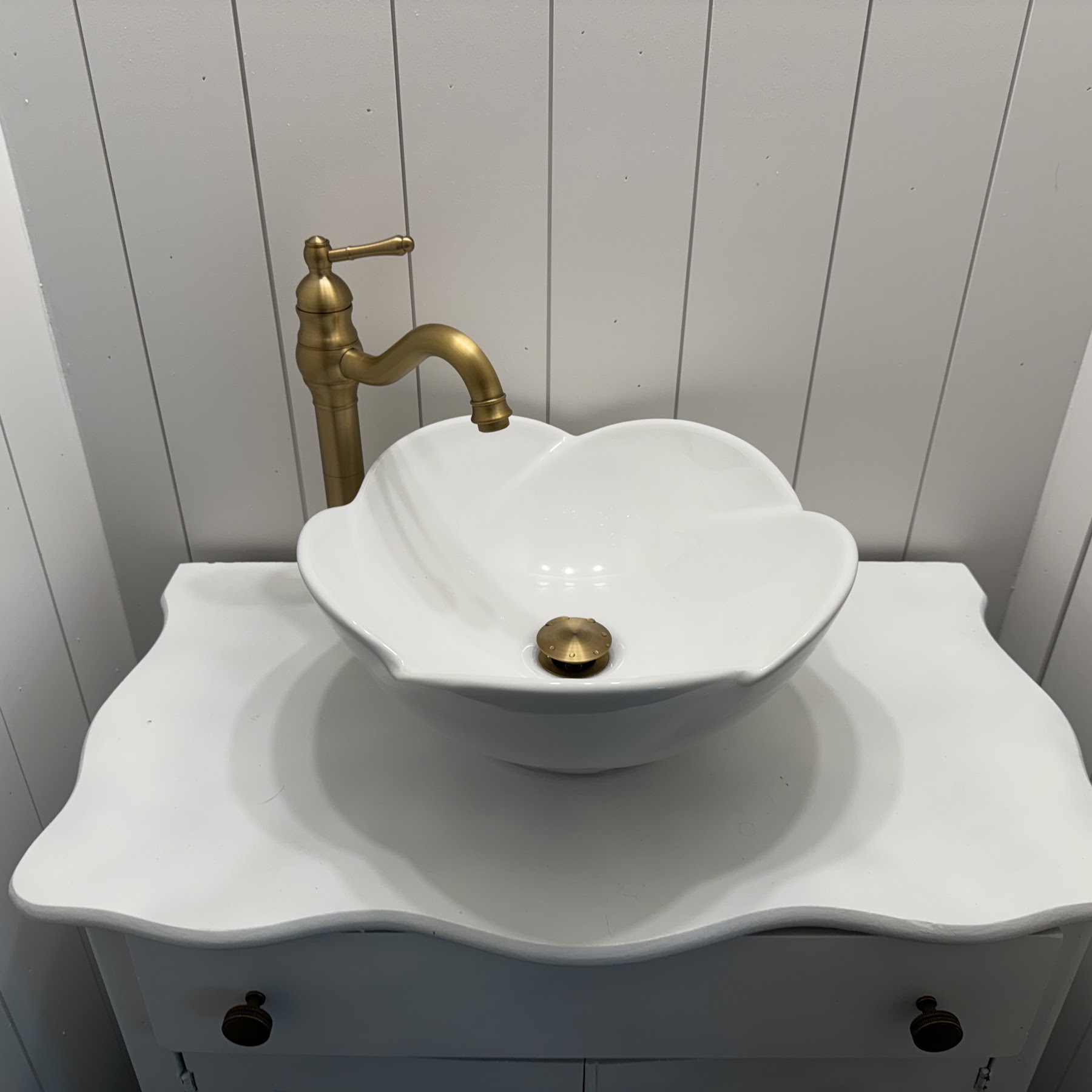 A beautifully installed vessel sink with brass fixtures showcases the craftsmanship and style Abacus Plumbing, Air Conditioning, & Electrical brings to every bathroom upgrade.