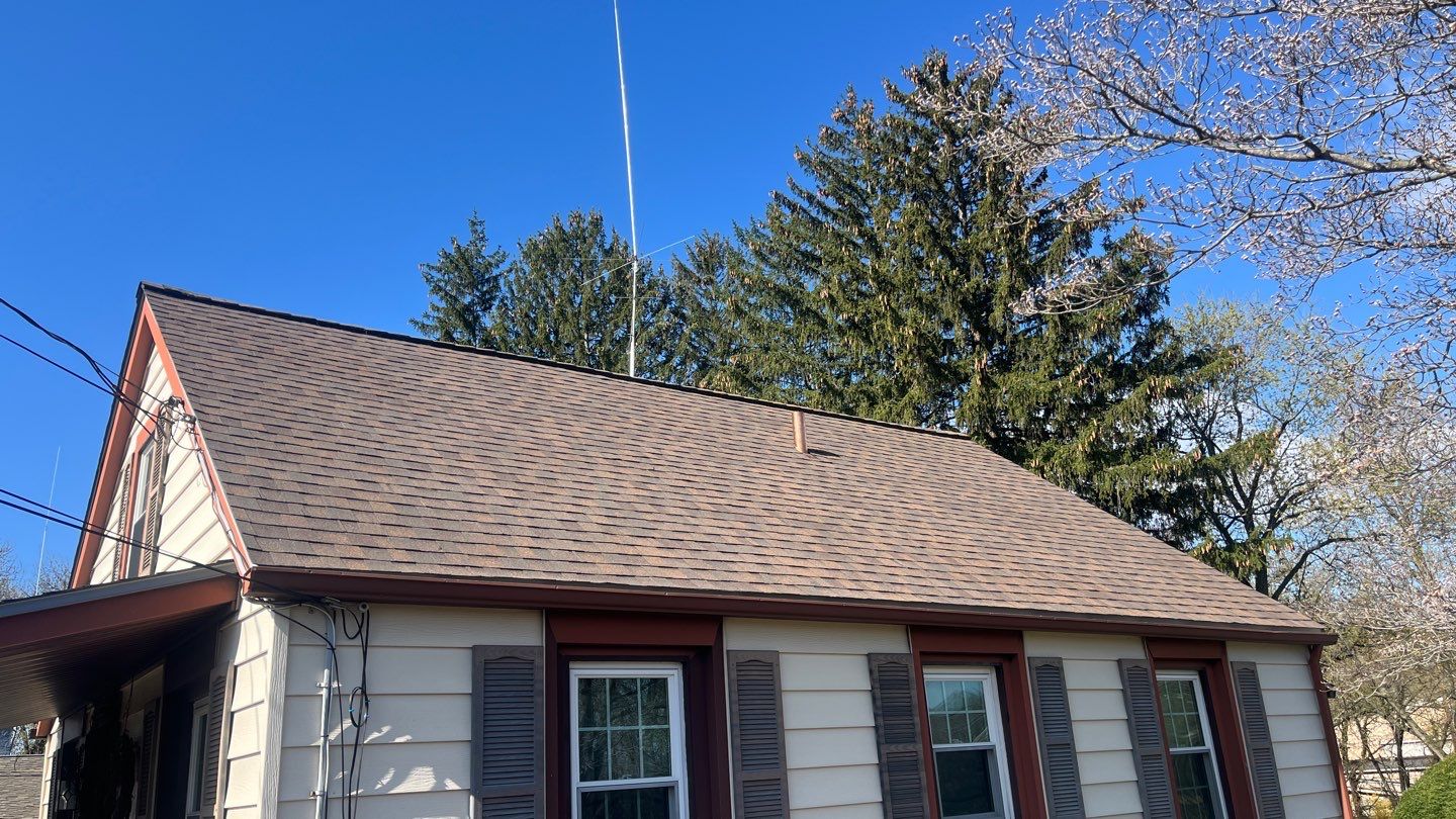 Solid craftsmanship and lasting protection showcased on this home, Mast Roofing & Construction delivering durable asphalt shingle results.
