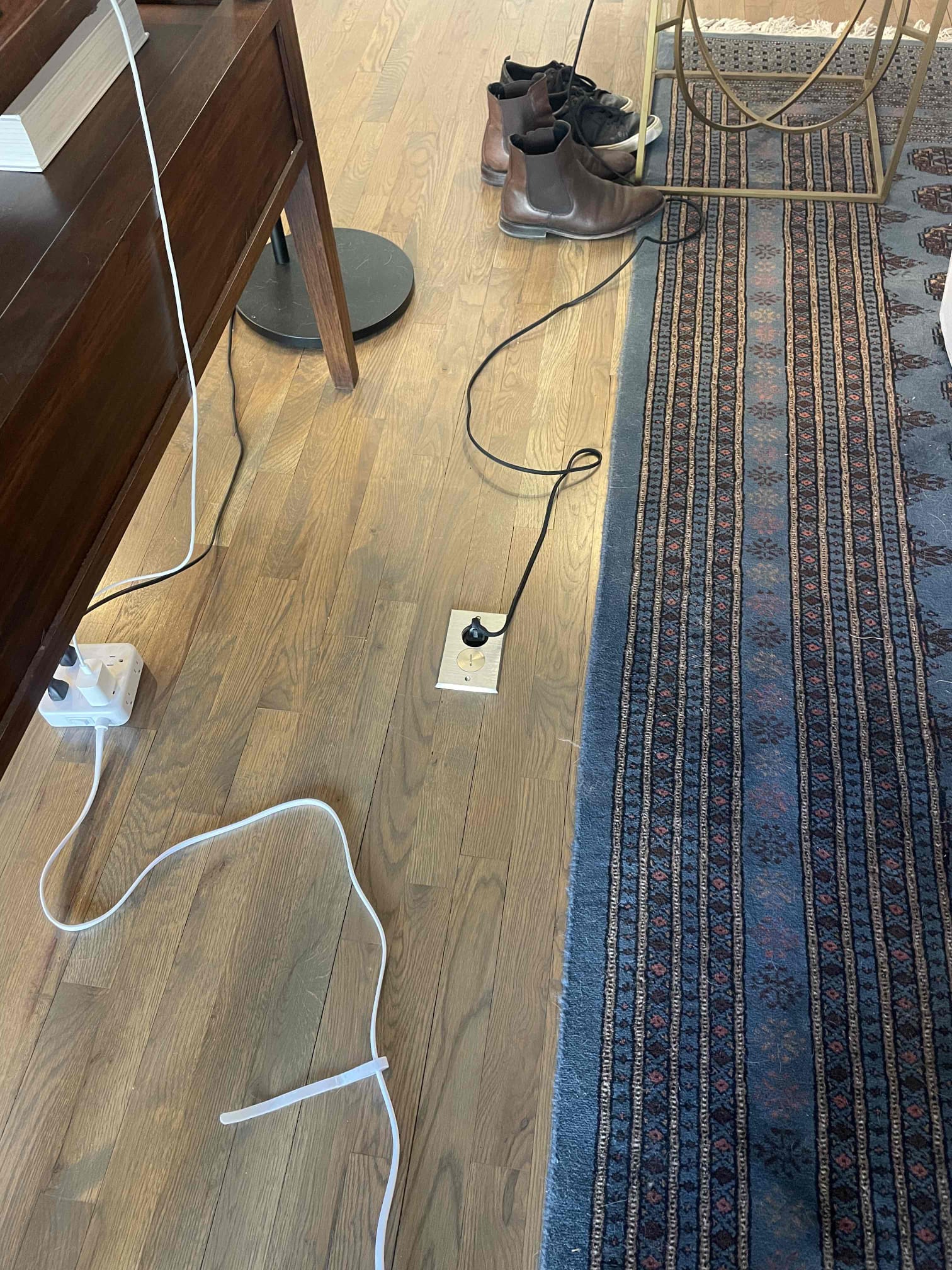 Neat recessed floor outlet and careful cable management show Dawson's Electric & Air protecting your home while delivering reliable electrical service.