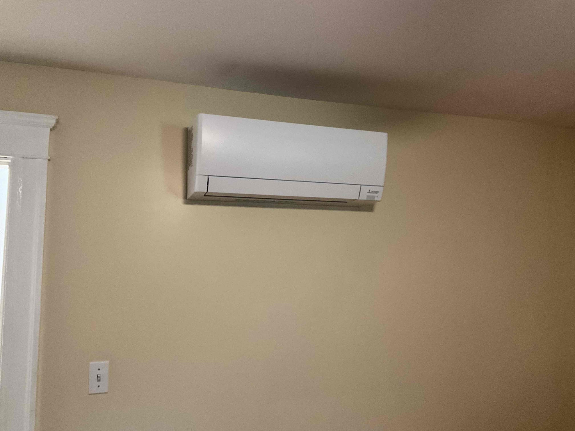 A cleanly installed ductless mini-split shows professional workmanship and attention to detail from Akian Plumbing, Heating, Cooling & Electric.
