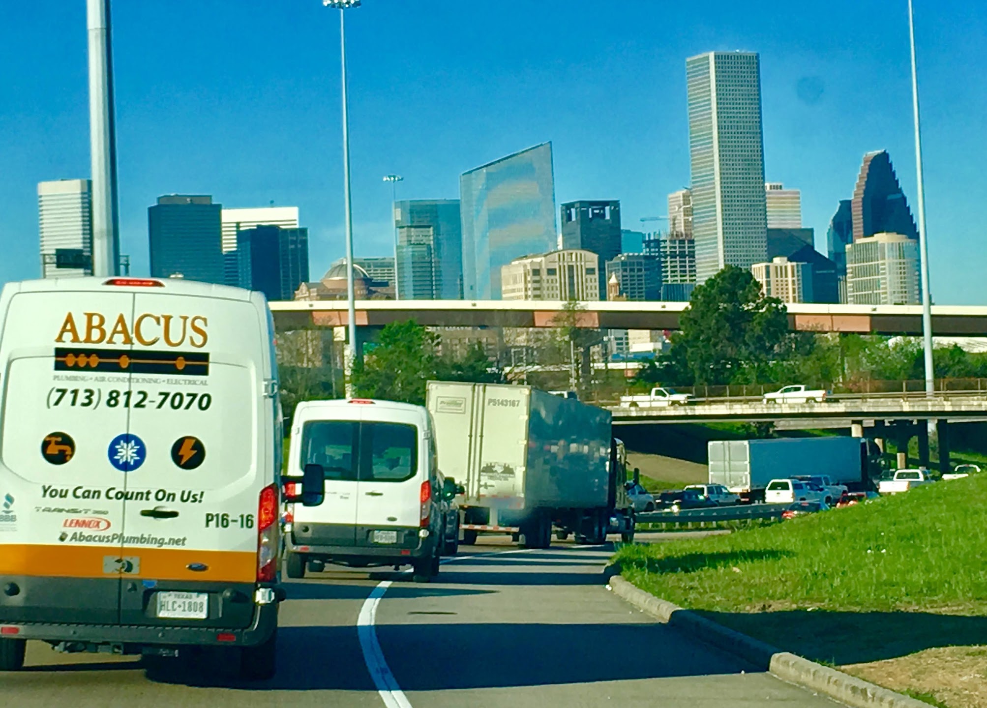 A clean, branded Abacus Plumbing, Air Conditioning & Electrical van on city roads highlights our reliable, professional service and prompt response.