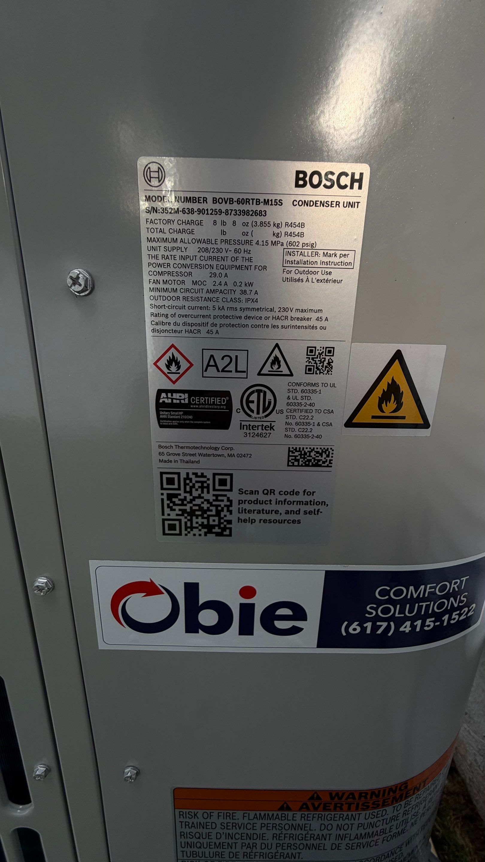 A professionally installed Bosch condenser with clear labeling and Obie Comfort Solutions branding to demonstrate dependable, safety-focused workmanship.