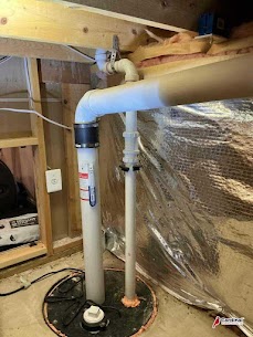 A clean, professionally installed sump pump and piping showcase the dependable craftsmanship customers trust from Cardinal Plumbing Heating & Air Inc.