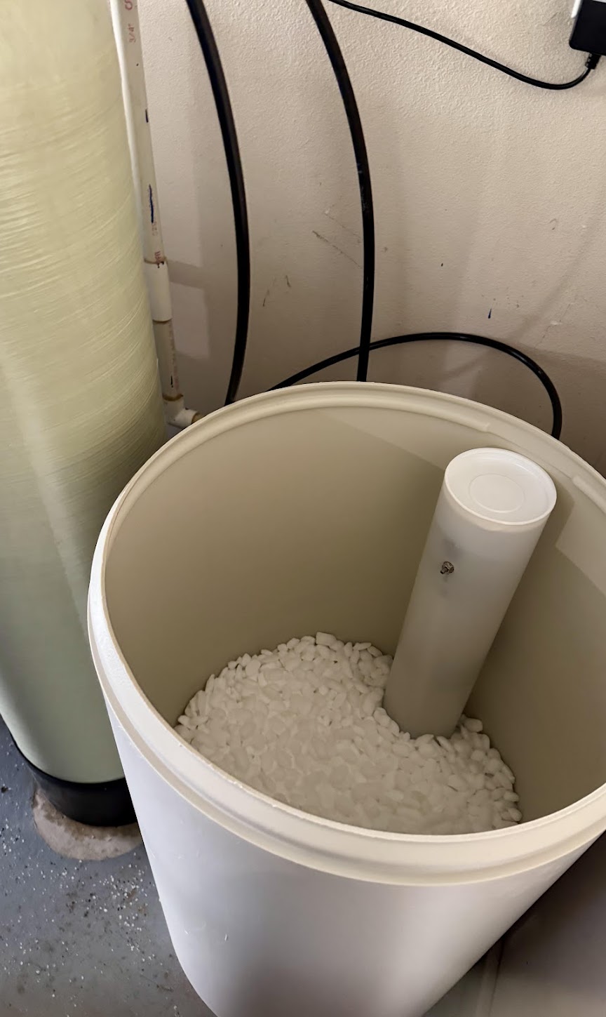 Cleanly refilled brine tank shows reliable water softening service from Abacus Plumbing, Air Conditioning, & Electrical for consistent home comfort.