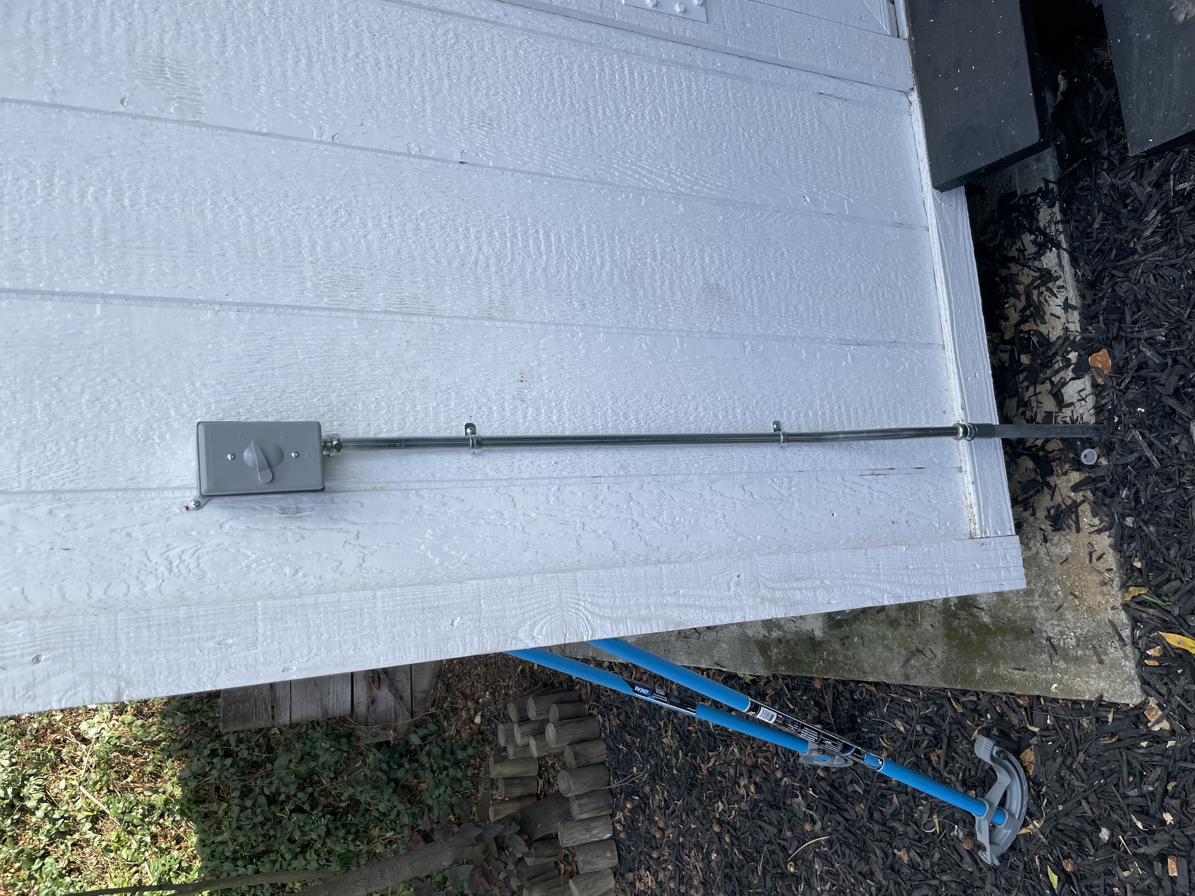 Clean, code-conscious exterior electrical work shows Powell Electric’s attention to durable, professional installations that protect your home.