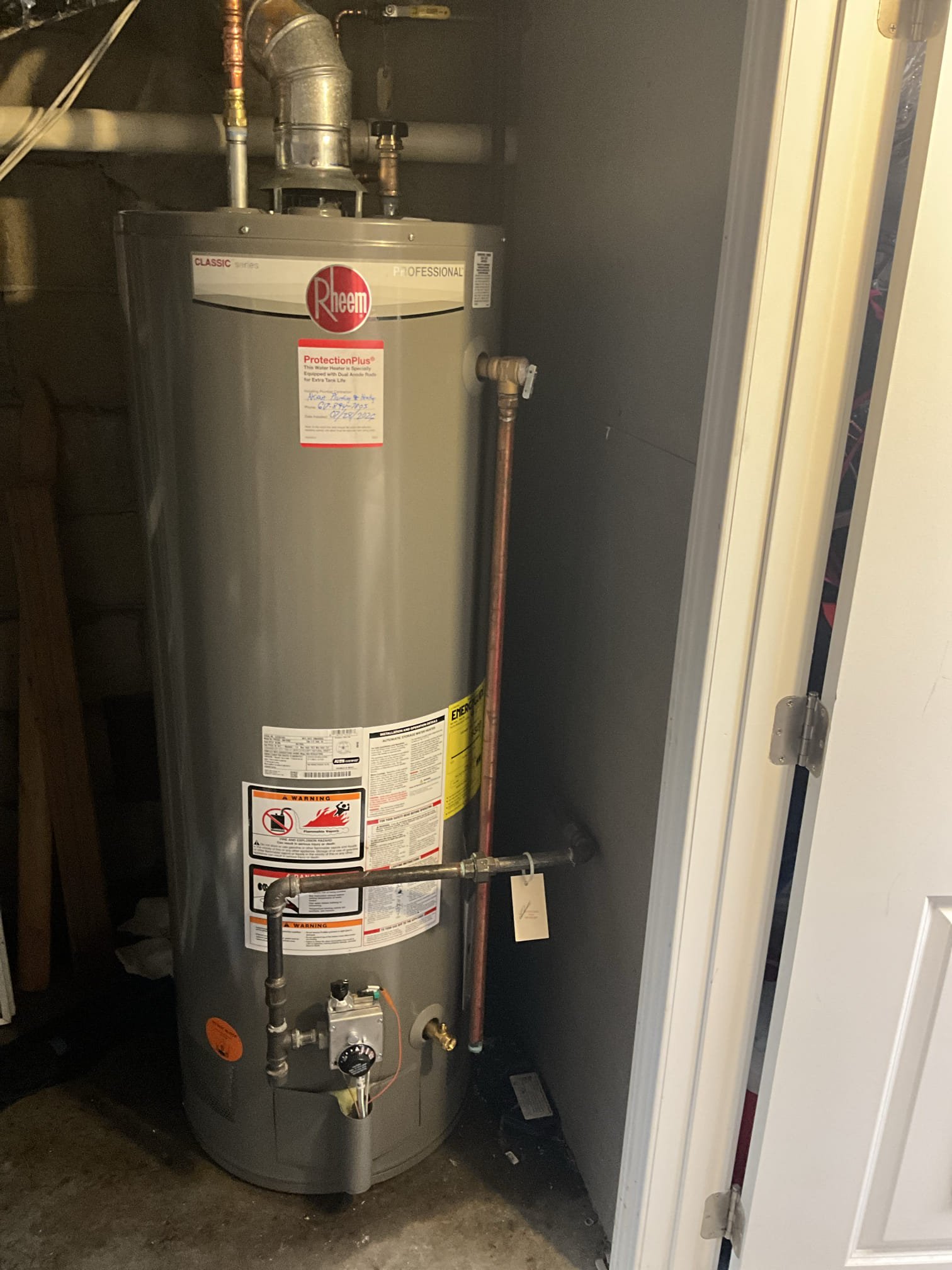 Showing reliable craftsmanship and tidy installation, Akian Plumbing, Heating, Cooling & Electric left this Rheem water heater ready for dependable service.
