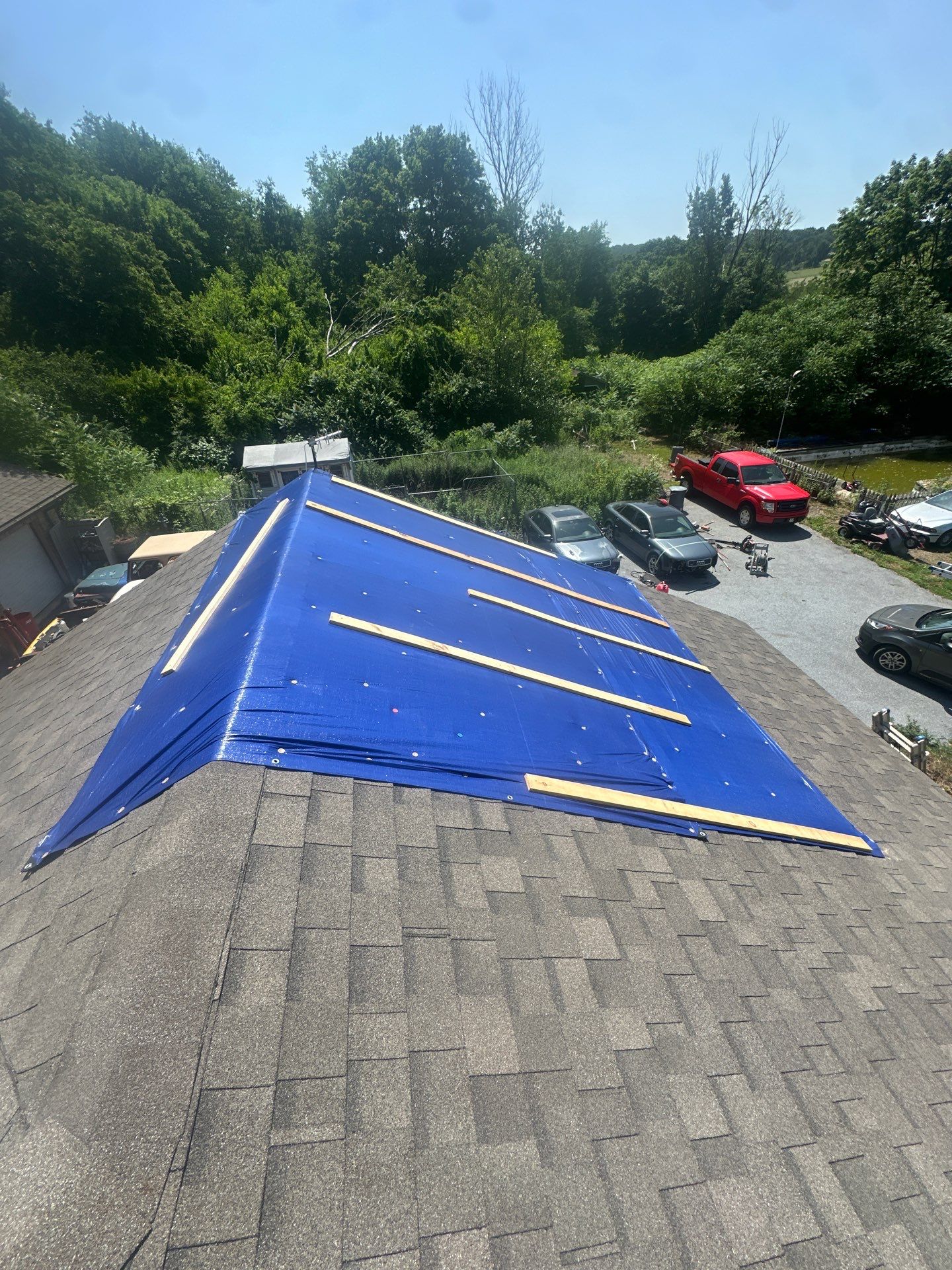 Mast Roofing & Construction protects your home fast with careful temporary tarping and secure fastening until a permanent repair is completed.