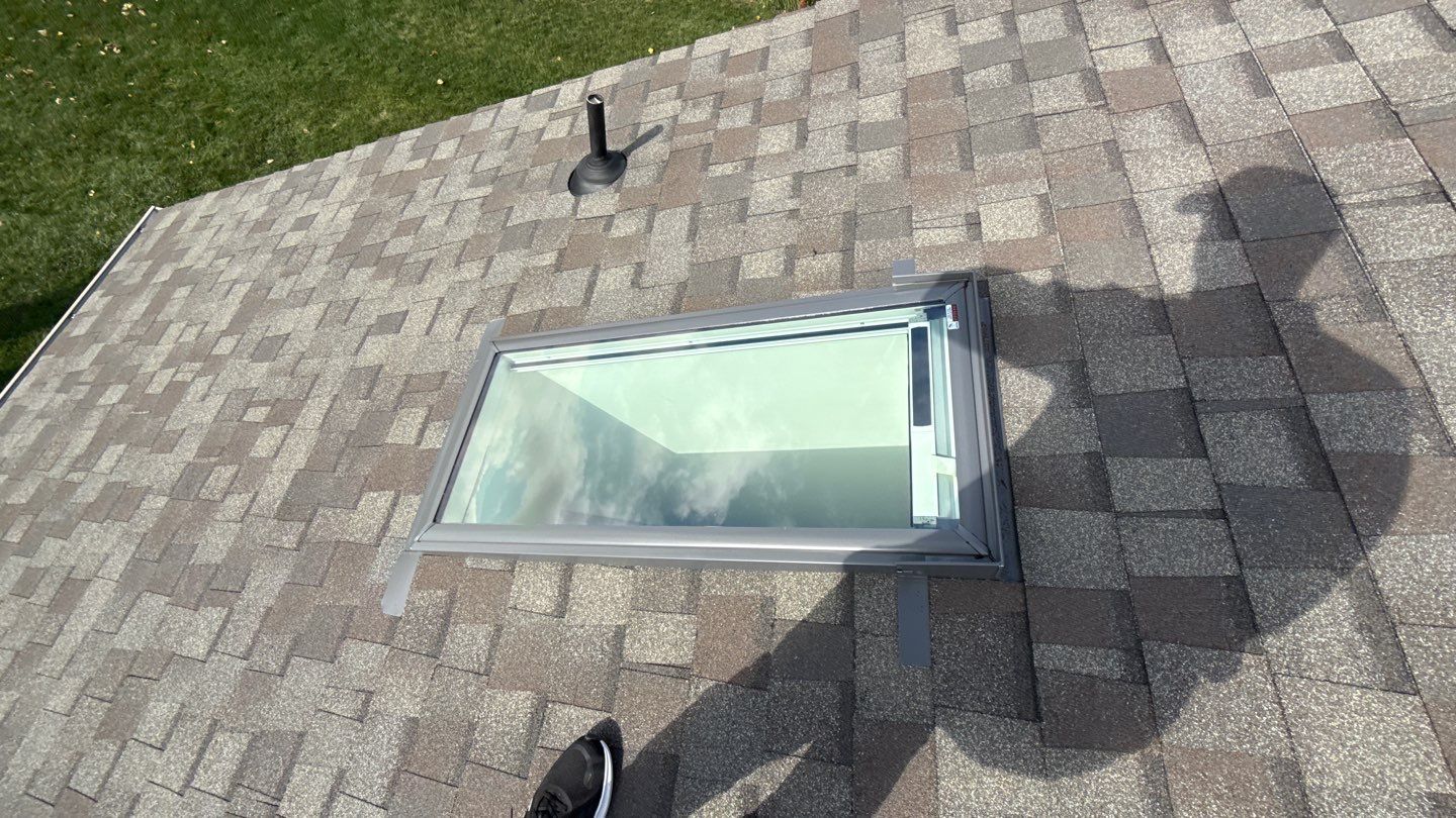 A clean, professionally installed skylight enhances durability and natural light, showcasing Mosaic Roofing & Exteriors attention to craftsmanship.