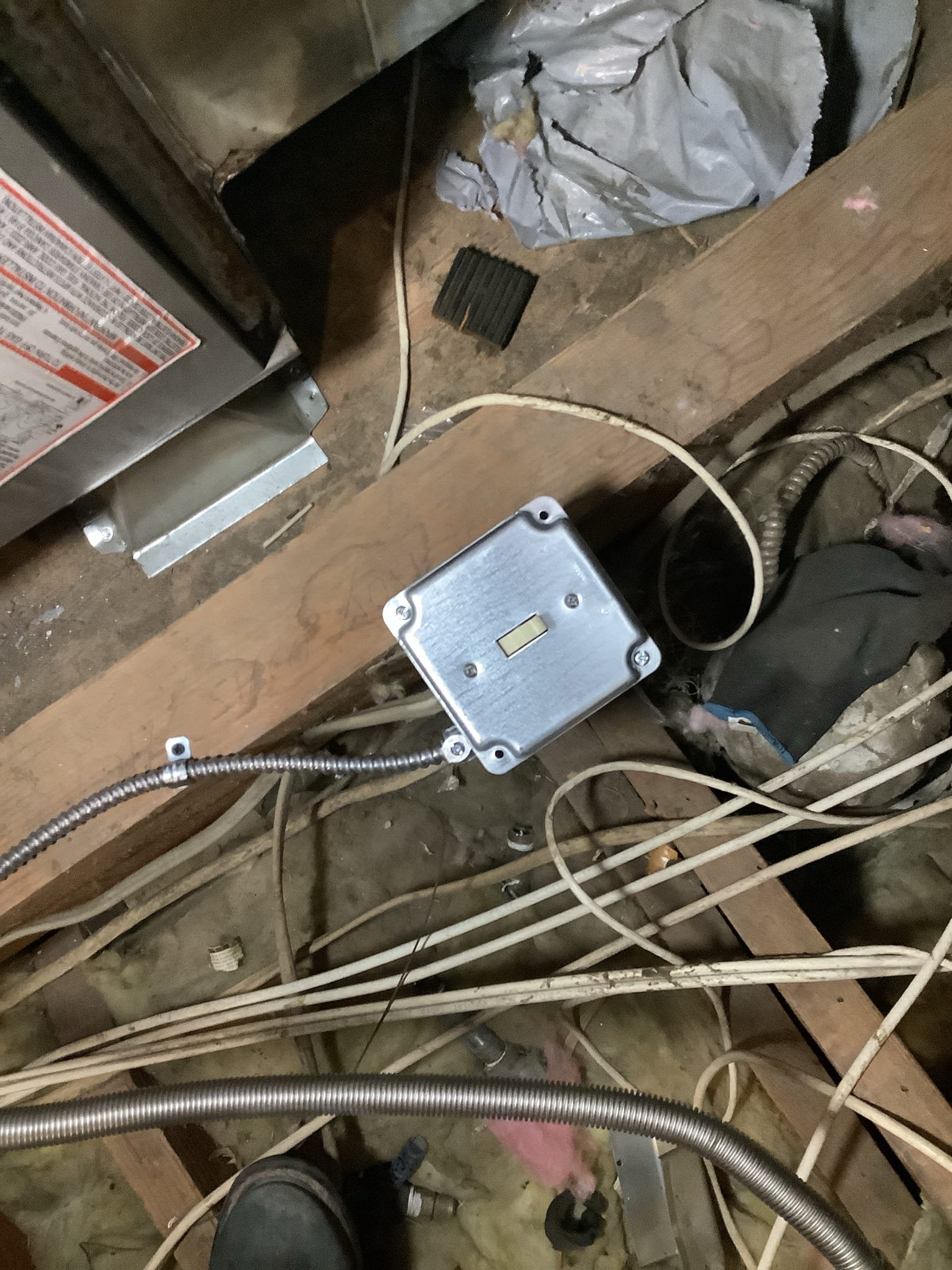 Powell Electric shows meticulous electrical access and safe conduit routing in attics, delivering reliable workmanship homeowners can trust.