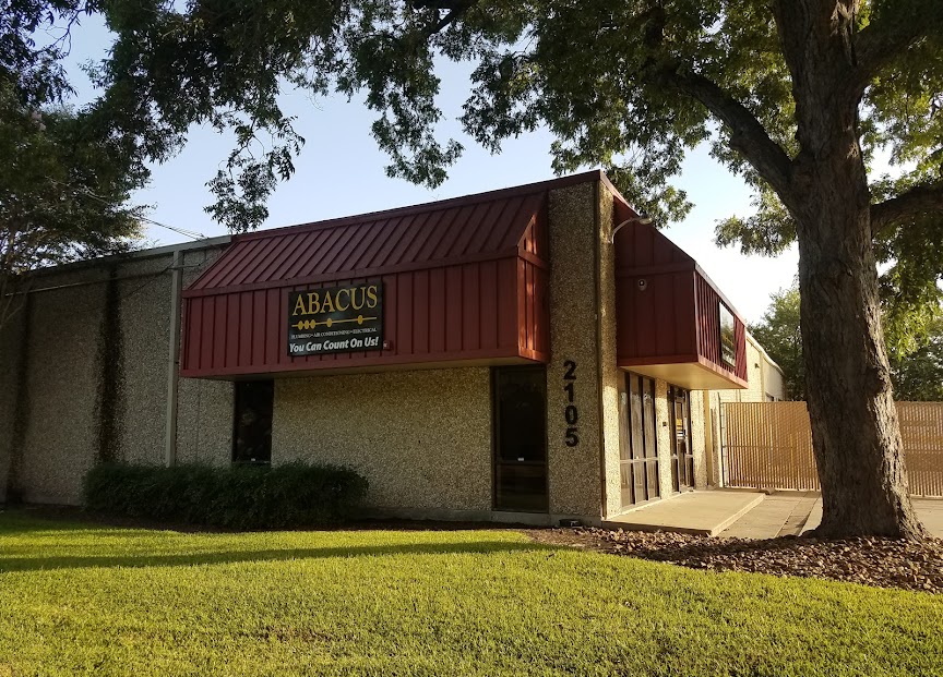 A well-kept storefront and clear ABACUS signage show Abacus Plumbing, Air Conditioning, & Electrical’s commitment to professional, reliable service.