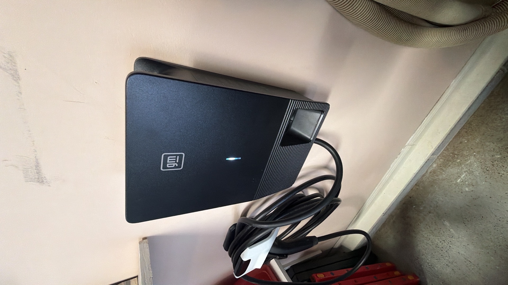 Clean, professional EV charger installation in a residential garage shows Atomic Electric Service Inc. delivering reliable, tidy charging solutions.