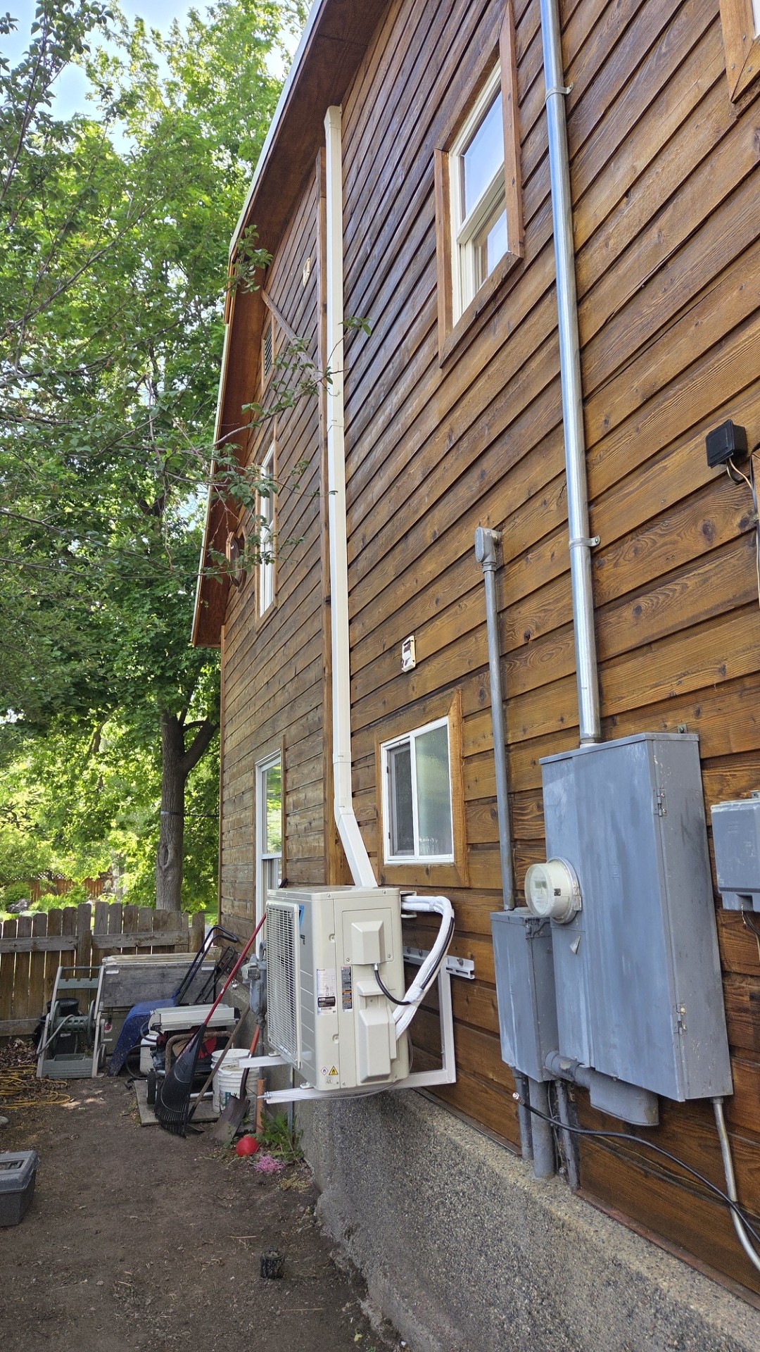 A neatly installed mini-split and tidy exterior routing show Home Heating & Air Conditioning delivering reliable, high-quality comfort solutions.