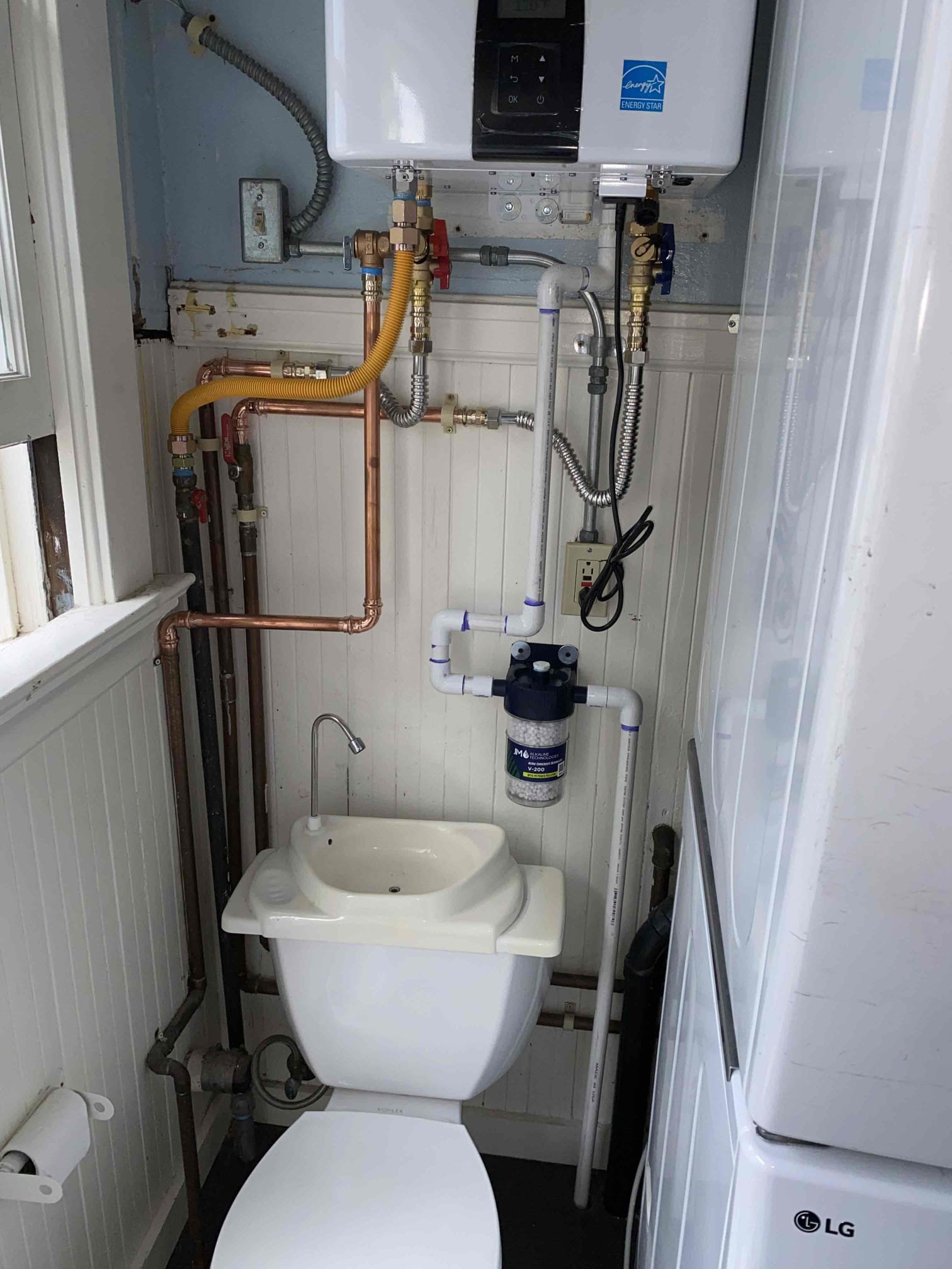 A tidy, space-saving plumbing install shows the care and craftsmanship customers trust from Magic Plumbing Heating & Cooling.