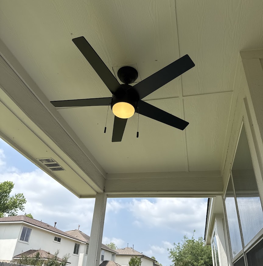A clean, professionally installed patio fan lights up outdoor living spaces, showcasing Abacus Plumbing, Air Conditioning, & Electrical’s attention to residential comfort.