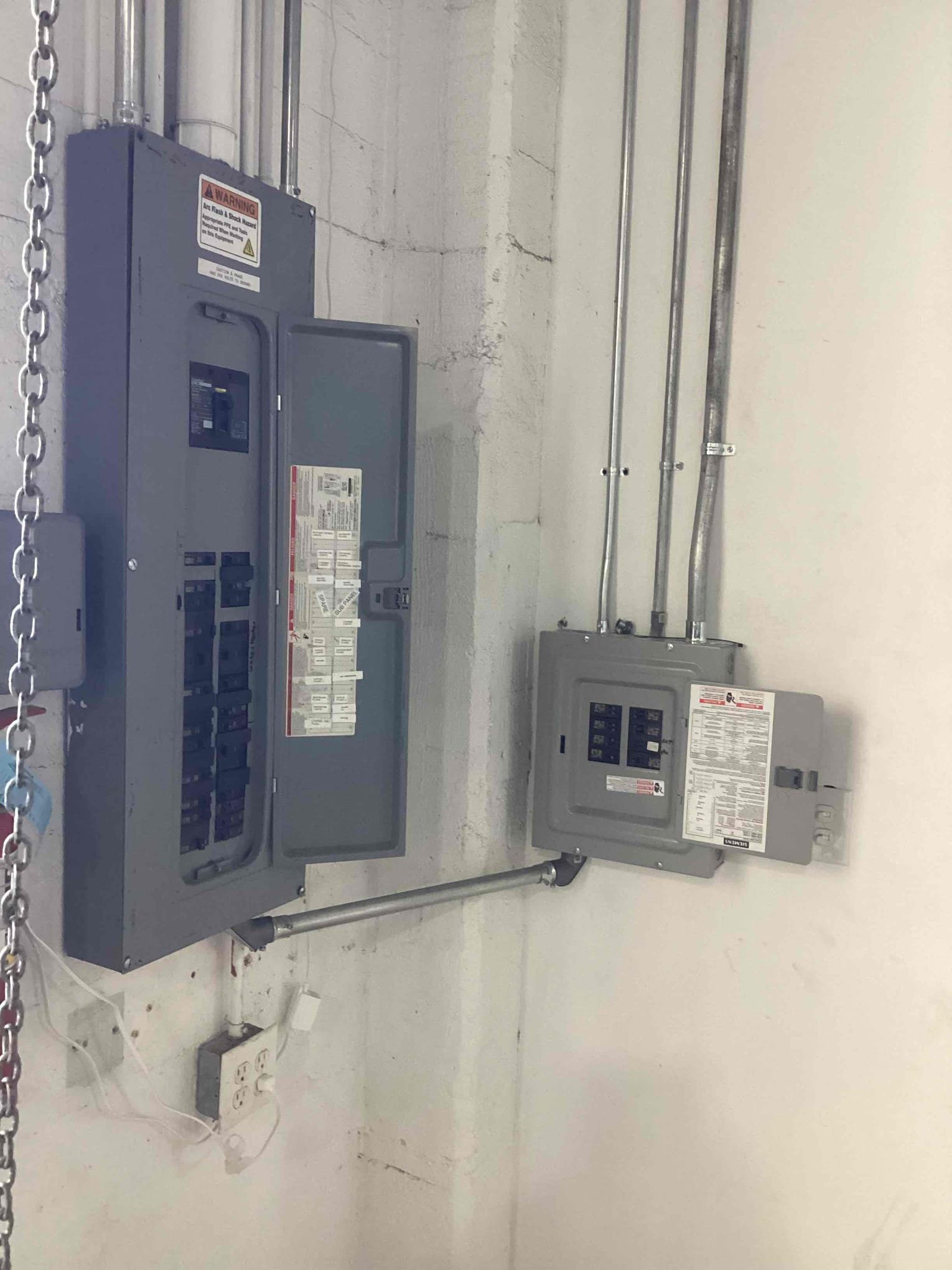 Powell Electric demonstrates reliable, organized electrical work with clearly labeled panels and tidy conduit for lasting safety.