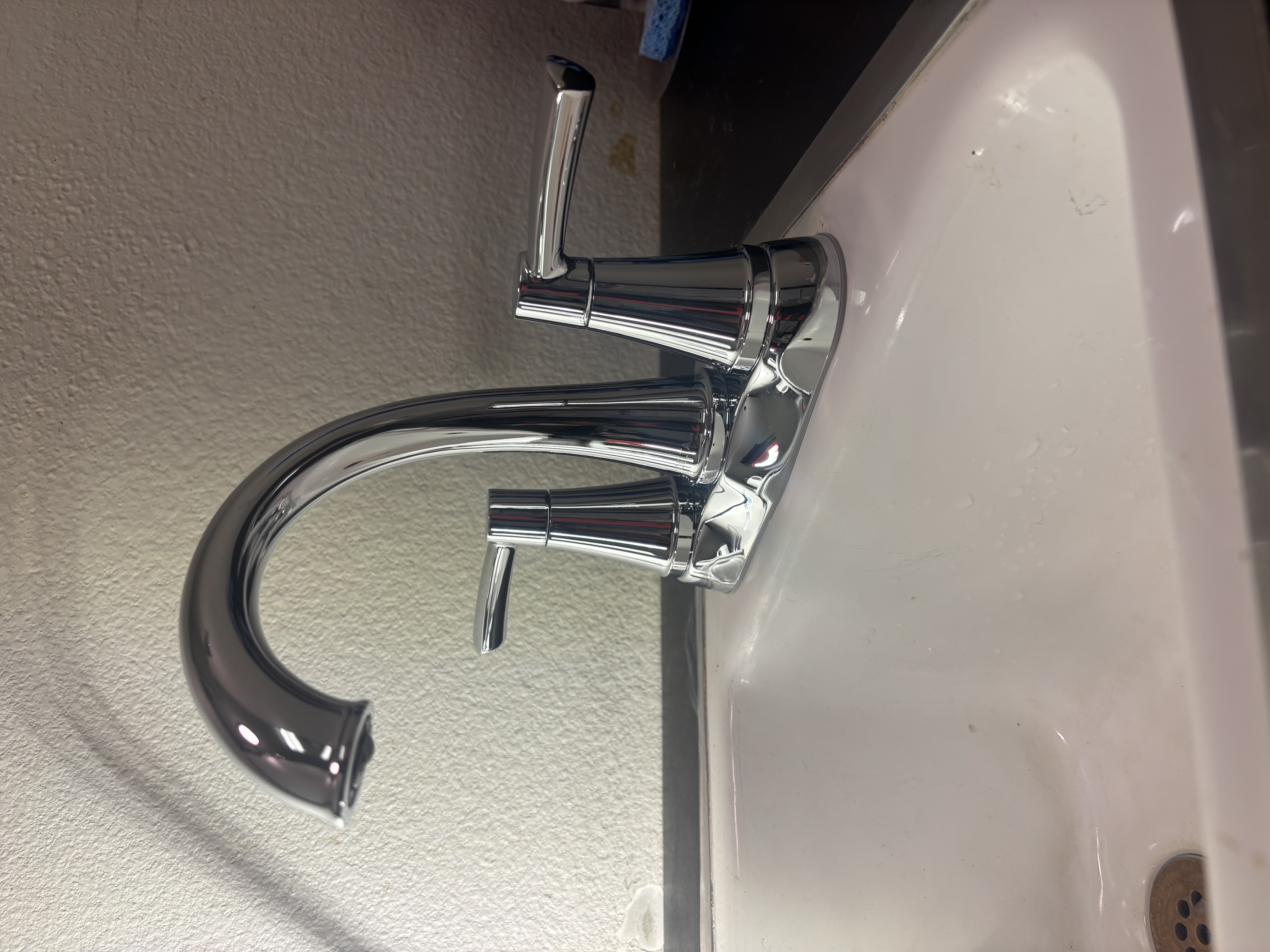 A gleaming chrome faucet installed with care showcases Island Plumbing's attention to craftsmanship and reliable results.