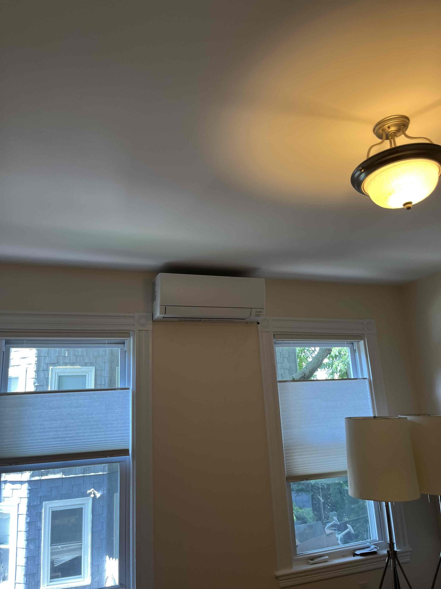 Bring reliable, neatly installed comfort to your home with Akian Plumbing, Heating, Cooling & Electric showcasing a clean ductless mini-split installation.