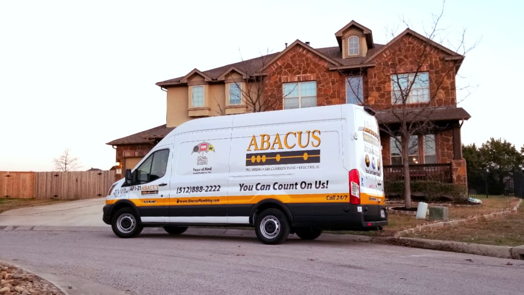 A clean, branded service van in a neighborhood shows Abacus Plumbing, Air Conditioning, & Electrical ready to deliver trusted, prompt home service.