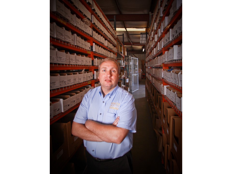 Confident and organized, Abacus Plumbing, Air Conditioning & Electrical demonstrates reliable service readiness with a well-managed parts warehouse.