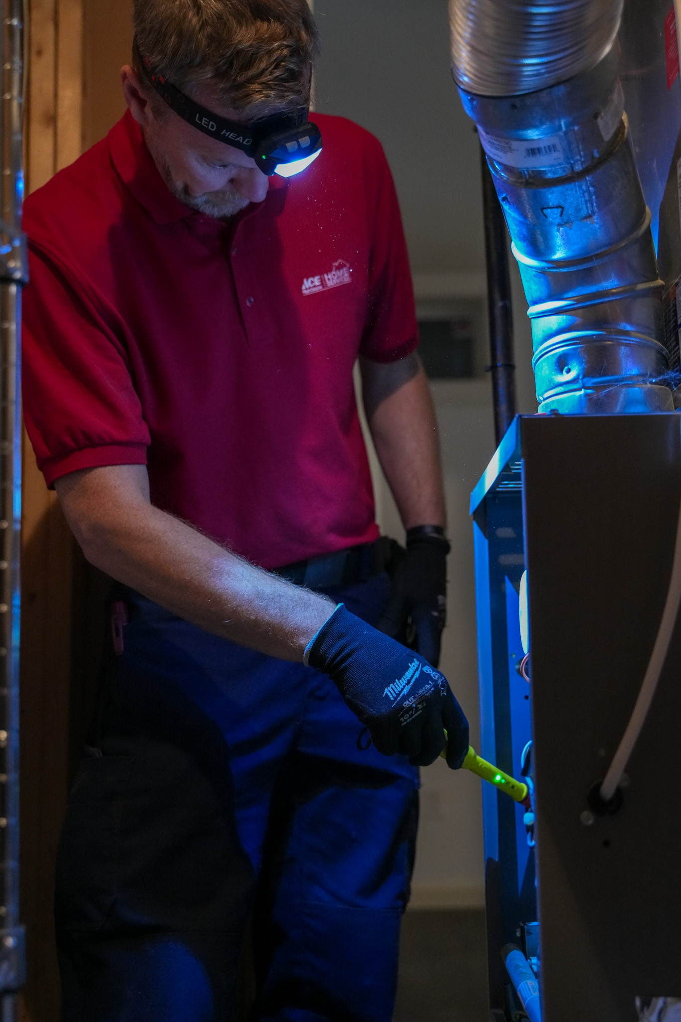 A Parrish Services technician delivers precise, professional HVAC care with attention to safety and reliable workmanship during inspections.
