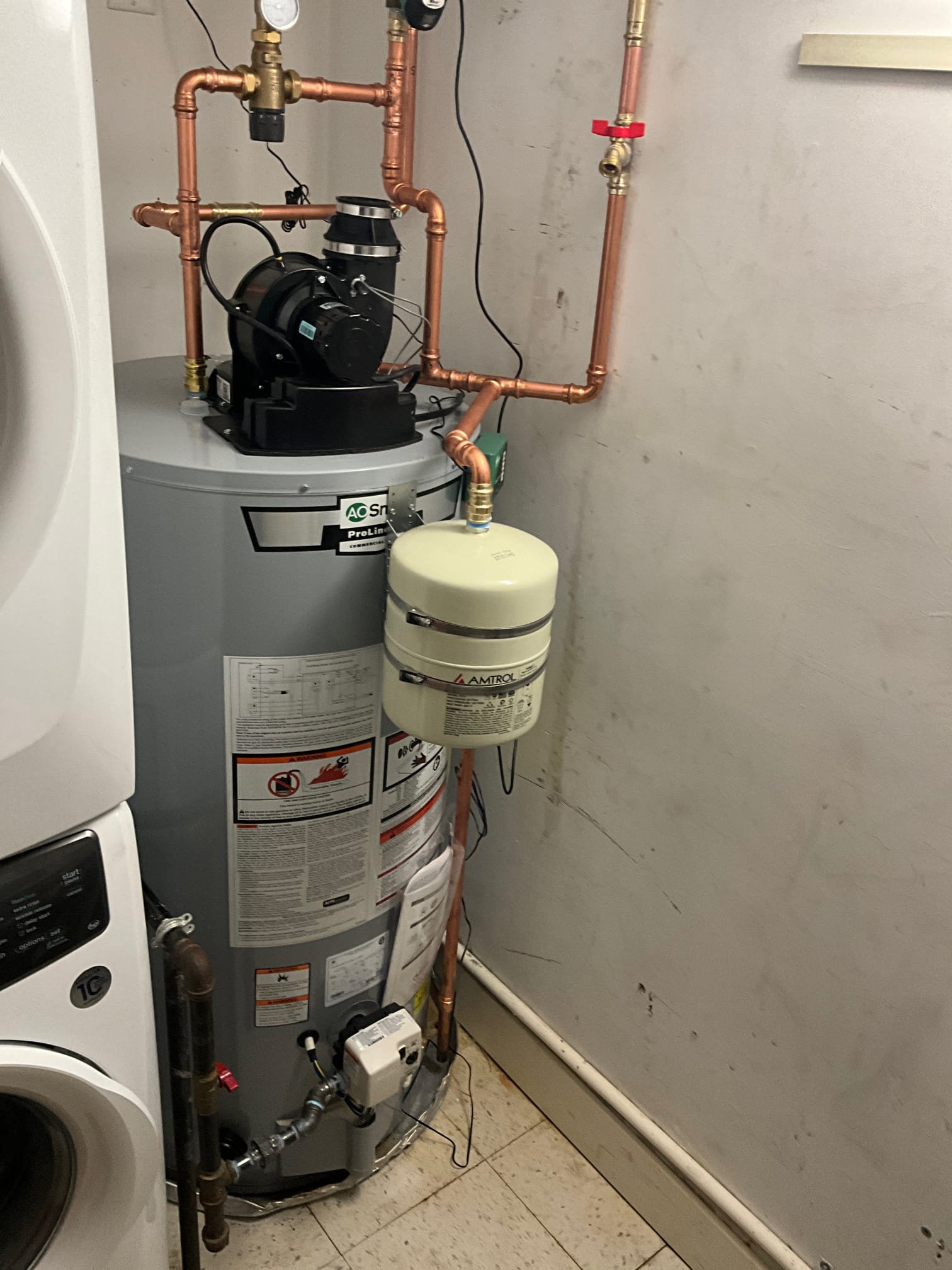 Akian Plumbing, Heating, Cooling & Electric installed a clean, durable water heater system with quality piping for long-lasting performance.